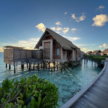 Ithaafushi, Maldives - November 2 2023: Overwater villas on the wooden walkway at the Waldorf Astoria Maldives Ithaafushi resort, License Type: media, Download Time: 2025-11-10T16:01:00.000Z, User: Malecia.Elamin_Lonelyplanet, Editorial: true, purchase_order: 65050 - Digital Destinations and Articles, job: Online editorial, client: How to choose the best Maldives island for your travel style, other: Malecia Walker