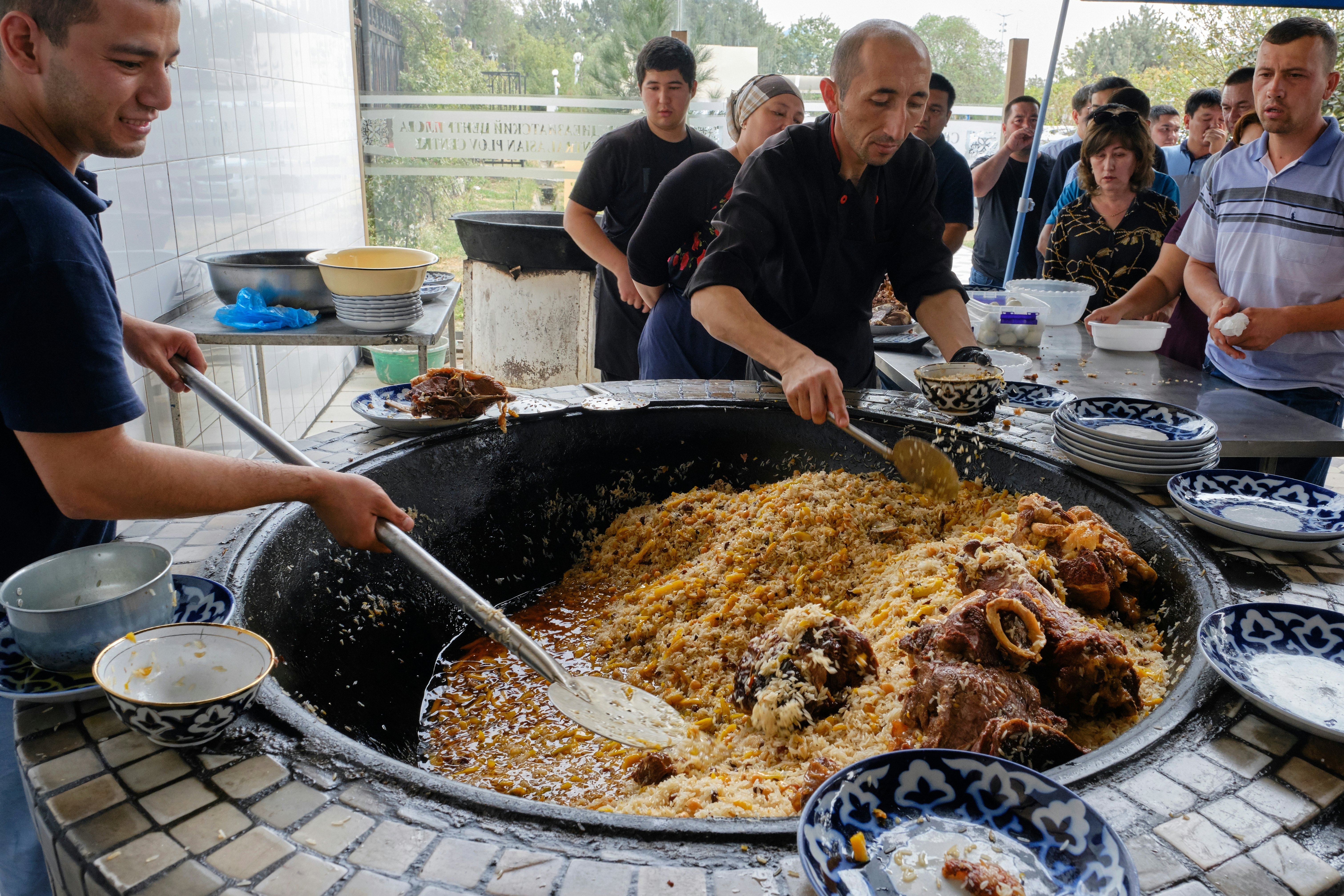 People wait to buy plov at the Central Asian Plov Centre in Tashkent, Uzbekistan.