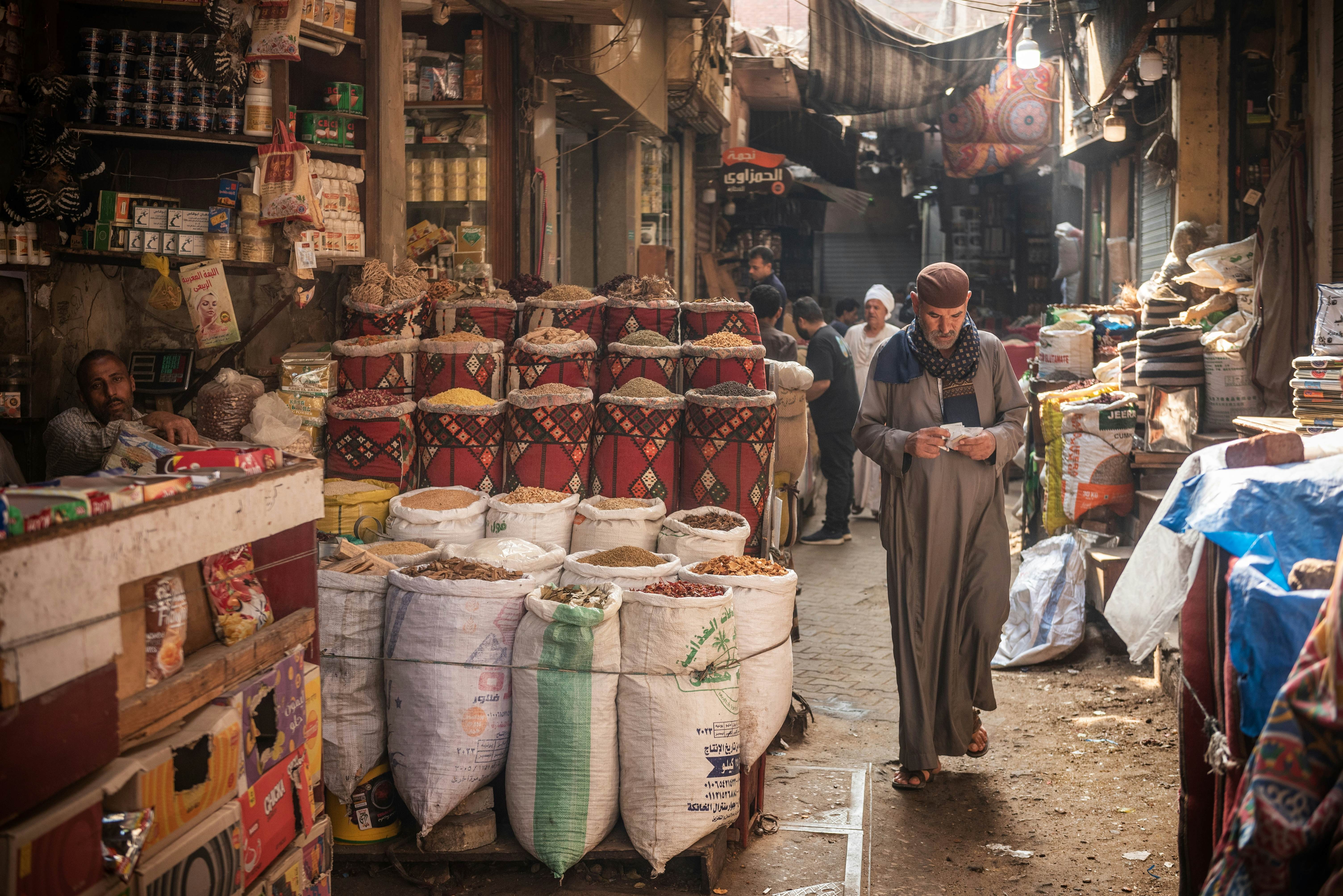 Cairo, Egypt. July 1st 2024An Egyptian man walking in the narrow streets of the spice market a busy souk popular with locals and tourists near Khan El Khalili Bazaar, Al Hussein, Cairo, Egypt. , License Type: media, Download Time: 2025-01-31T11:54:17.000Z, User: sashabrady26, Editorial: true, purchase_order: 65050 - Digital Destinations and Articles, job: Lonely Planet, client: Photo haul, other: Sasha Brady