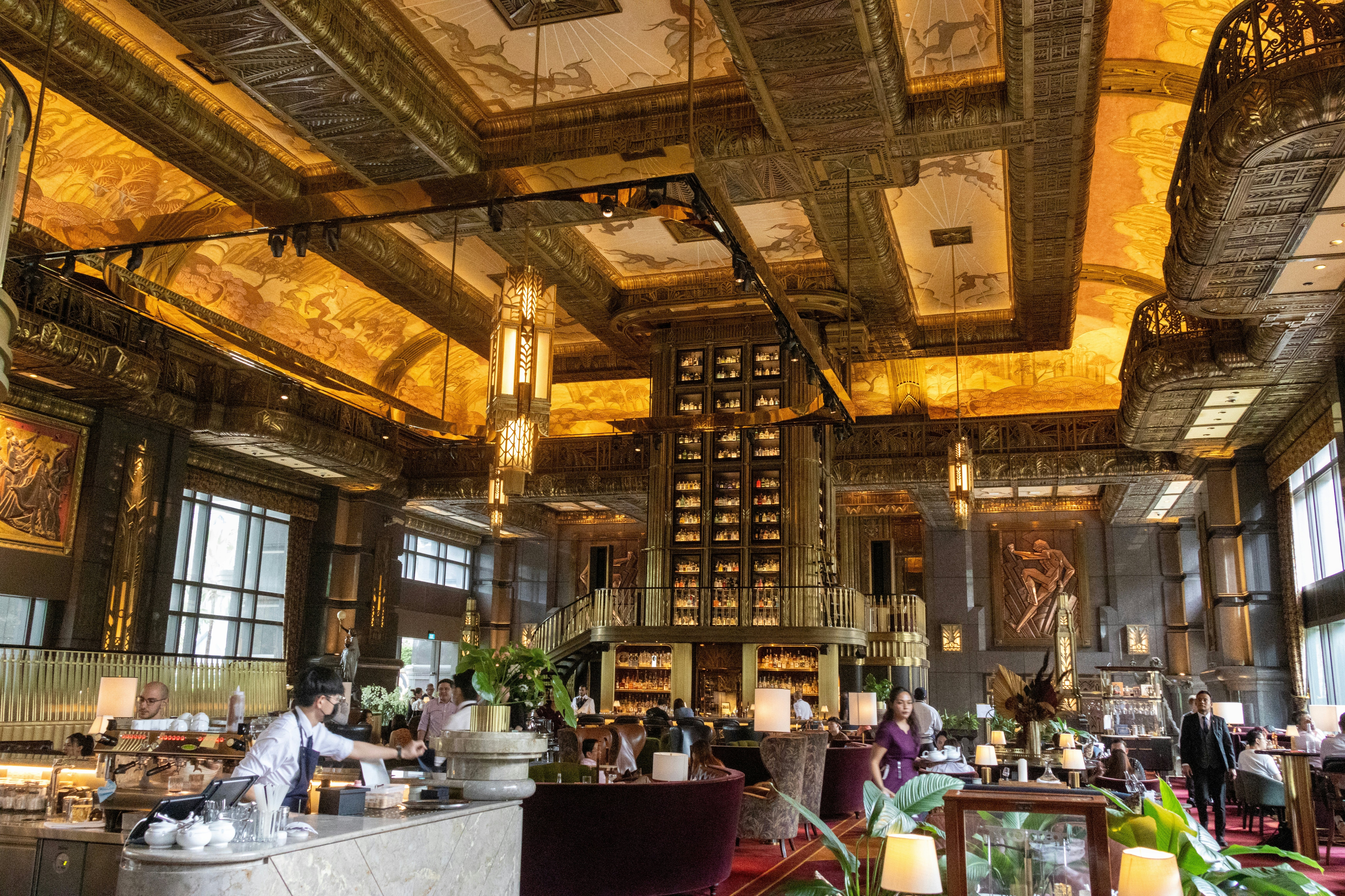 A large lobby bar with ornate ceiling.