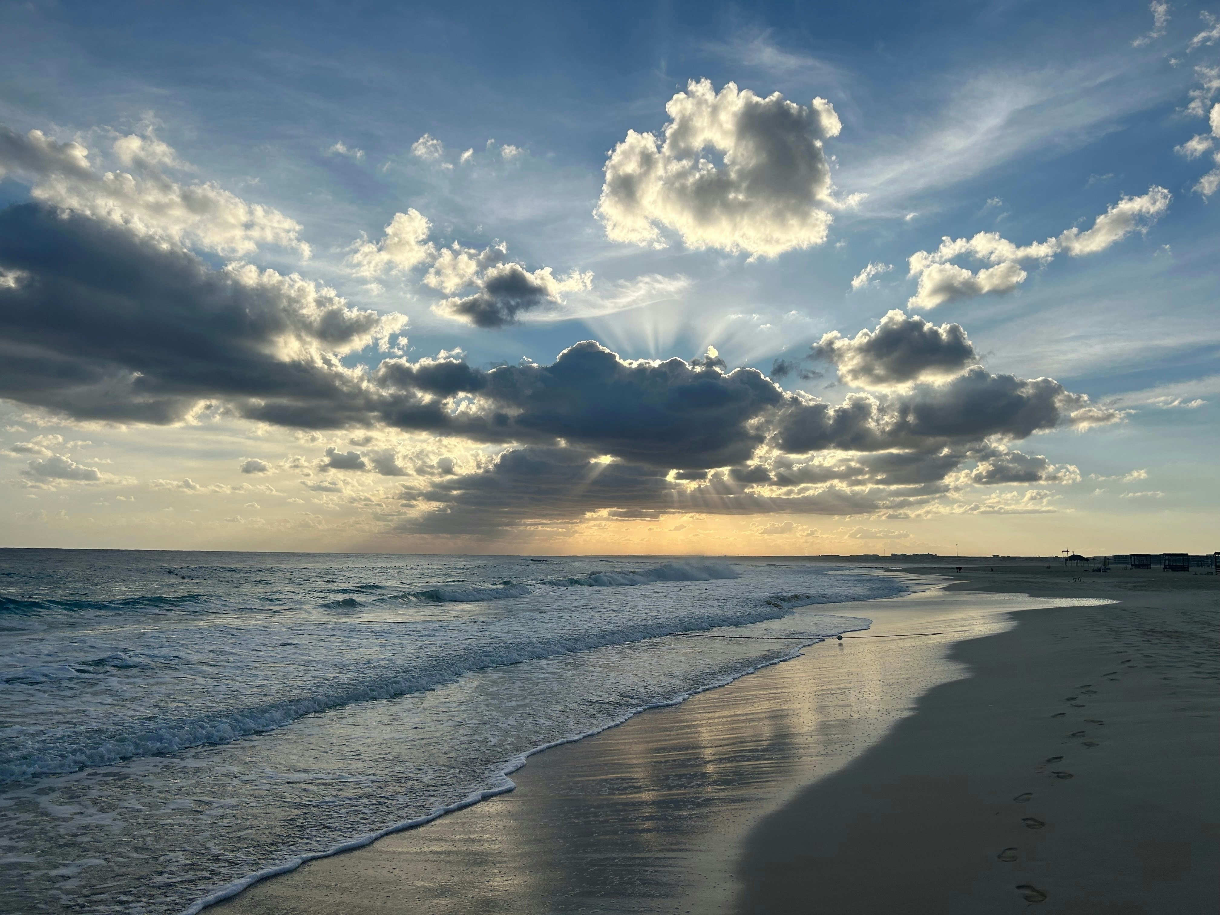 A cloud-dotted sky over the beach at Almaza Bay, Egypt.