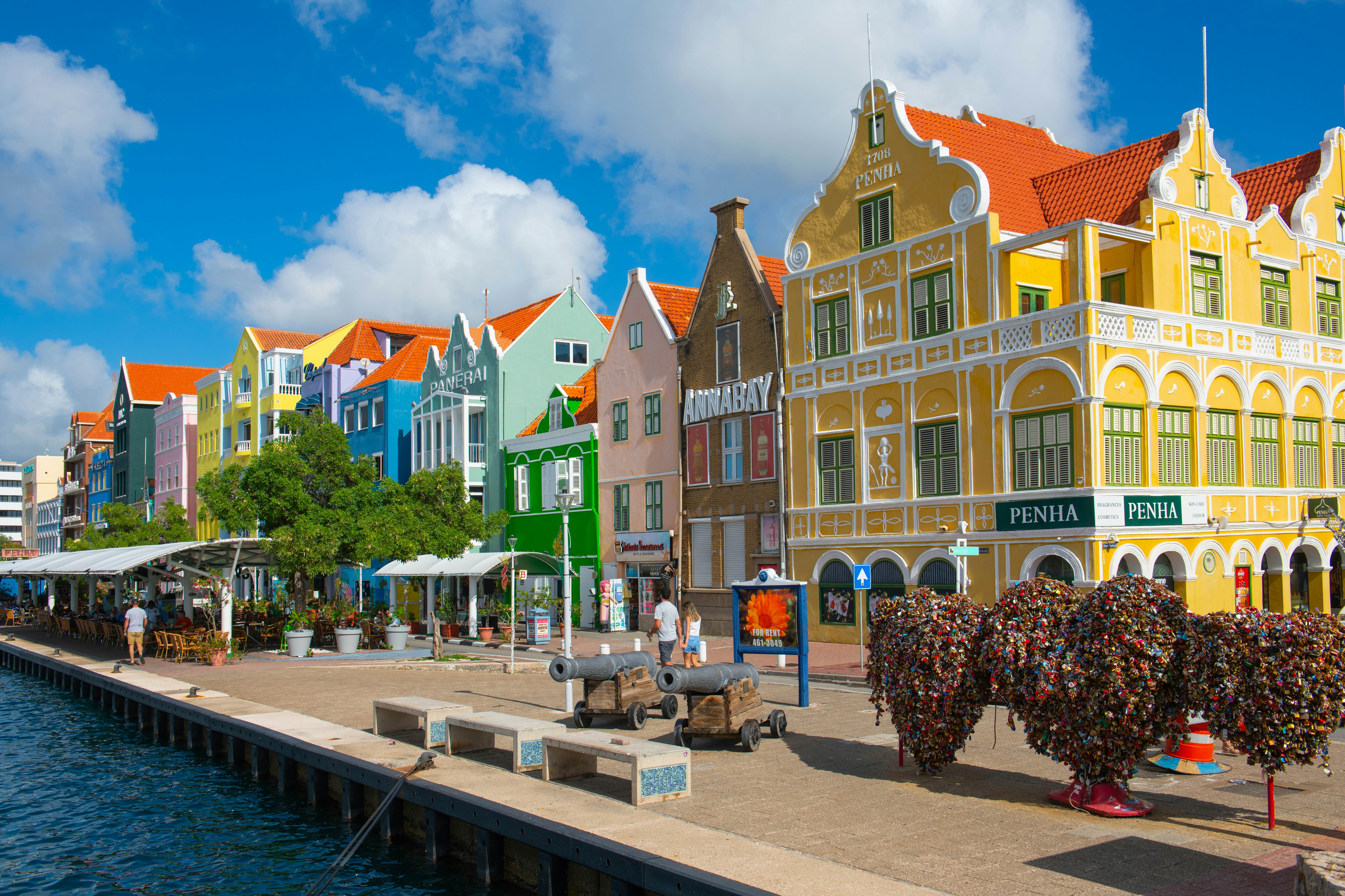 CURACAO - NOV. 30, 2024: Historic waterfront commercial houses with Dutch style on Handelskade Street in Punda, Willemstad, Curacao. Historic Willemstad is a UNESCO World Heritage Site. , License Type: media, Download Time: 2025-07-15T18:04:44.000Z, User: dorota_littlerobindesign, Editorial: true, purchase_order: 56530 - Guidebooks, job: Global Publishing WIP, client: Experience Aruba 1, other: Dorota Michalec