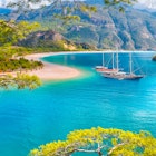 Black and Brown gulet anchored at the Aegean sea - Panoramic view of Oludeniz Beach And Blue Lagoon, Oludeniz beach is best beaches in Turkey - Fethiye, Turkey, License Type: media, Download Time: 2025-01-21T11:16:53.000Z, User: claire.guest, Editorial: false, purchase_order: 56500 - T&R or Kids, job: Global Publishing-WIP, client: The Mediterranean, other: Claire Guest