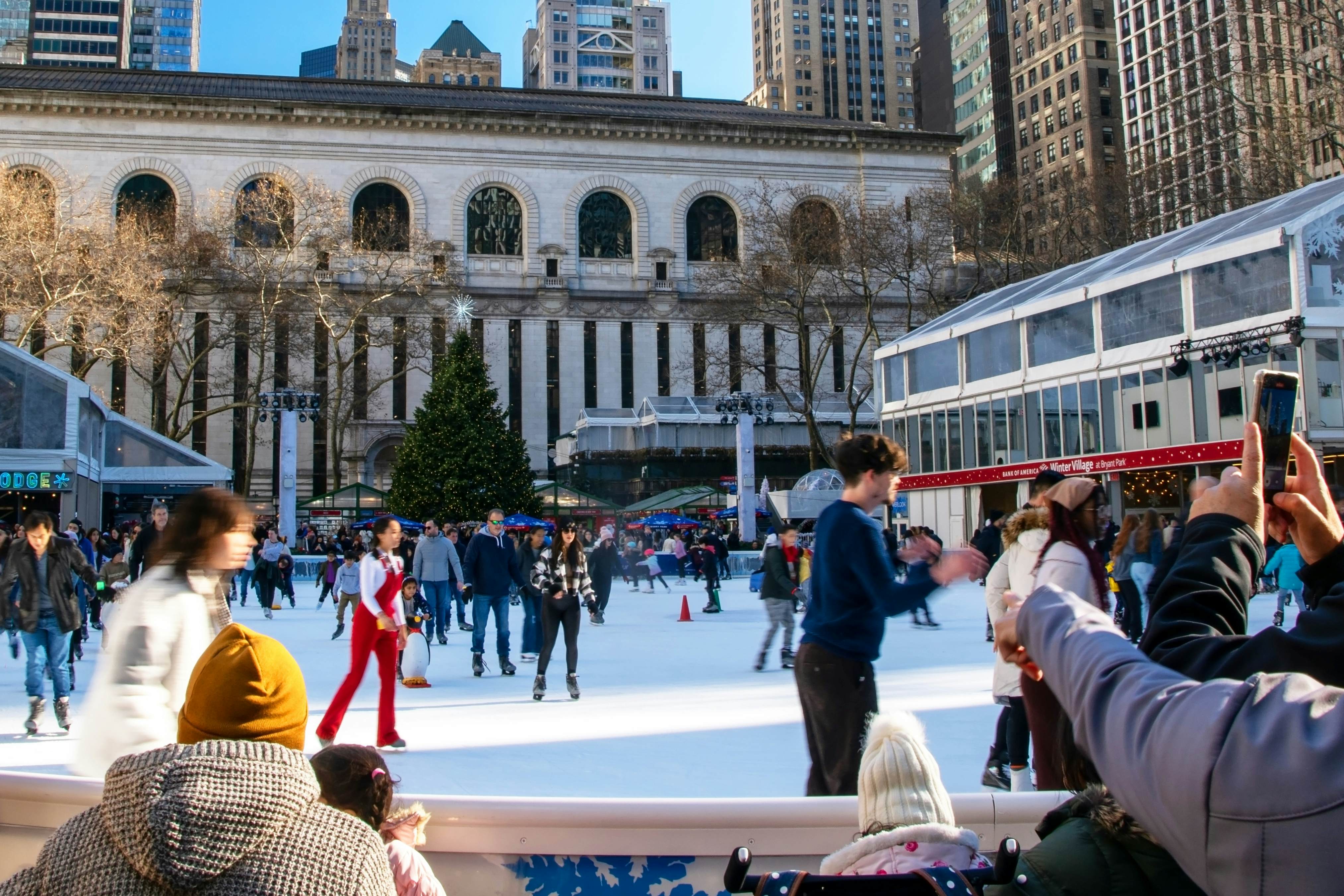 Ice skating at Bryant Park in New York City during the winter season,
