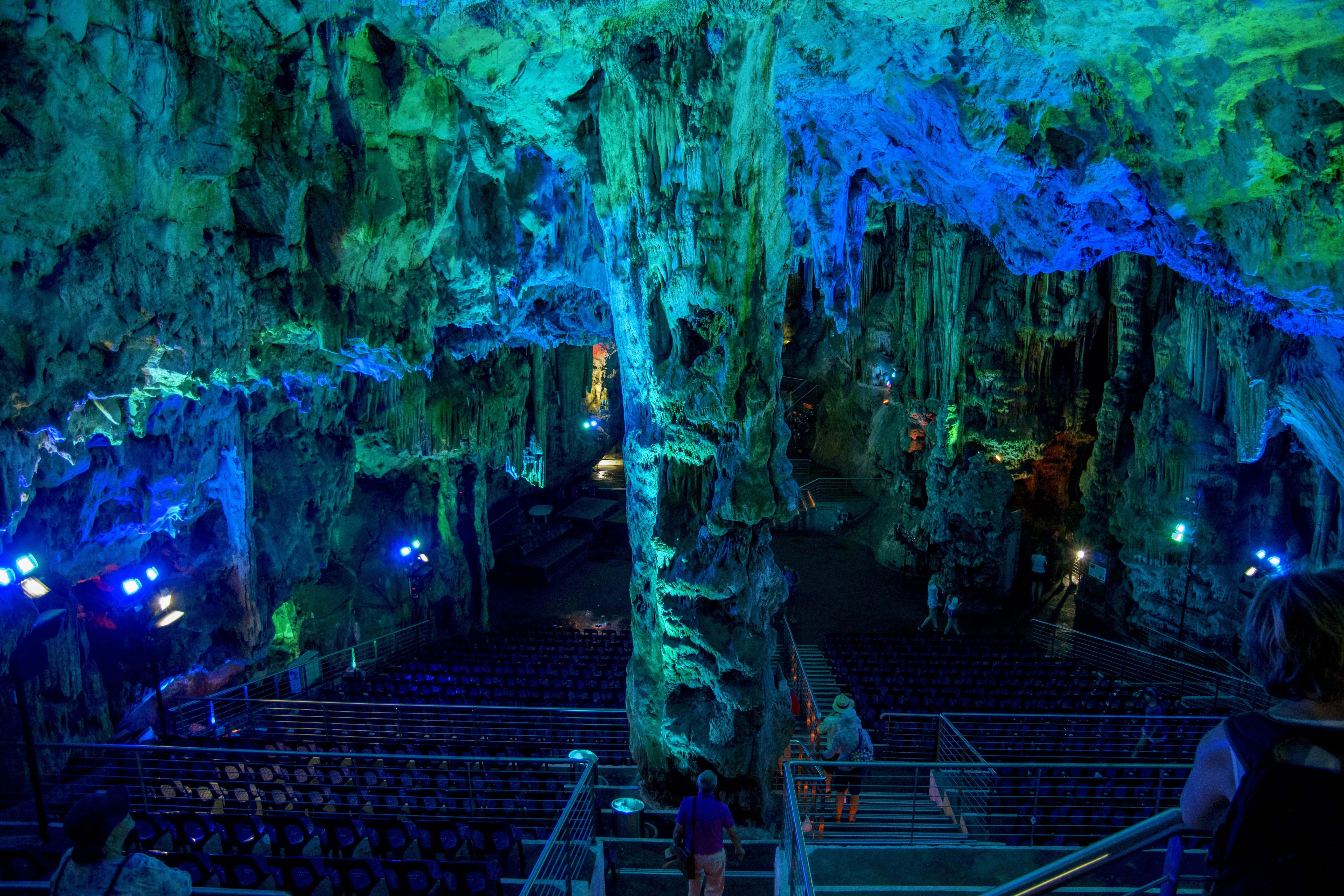 A cave enhanced with light that makes its ceilings blue and green