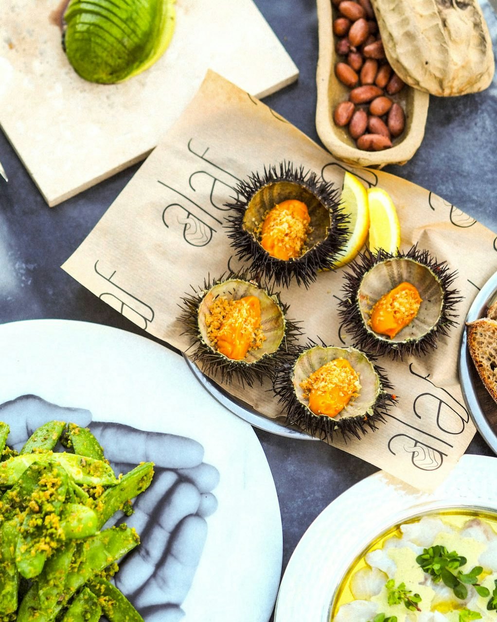 A series of small dishes loaded with vegetables.