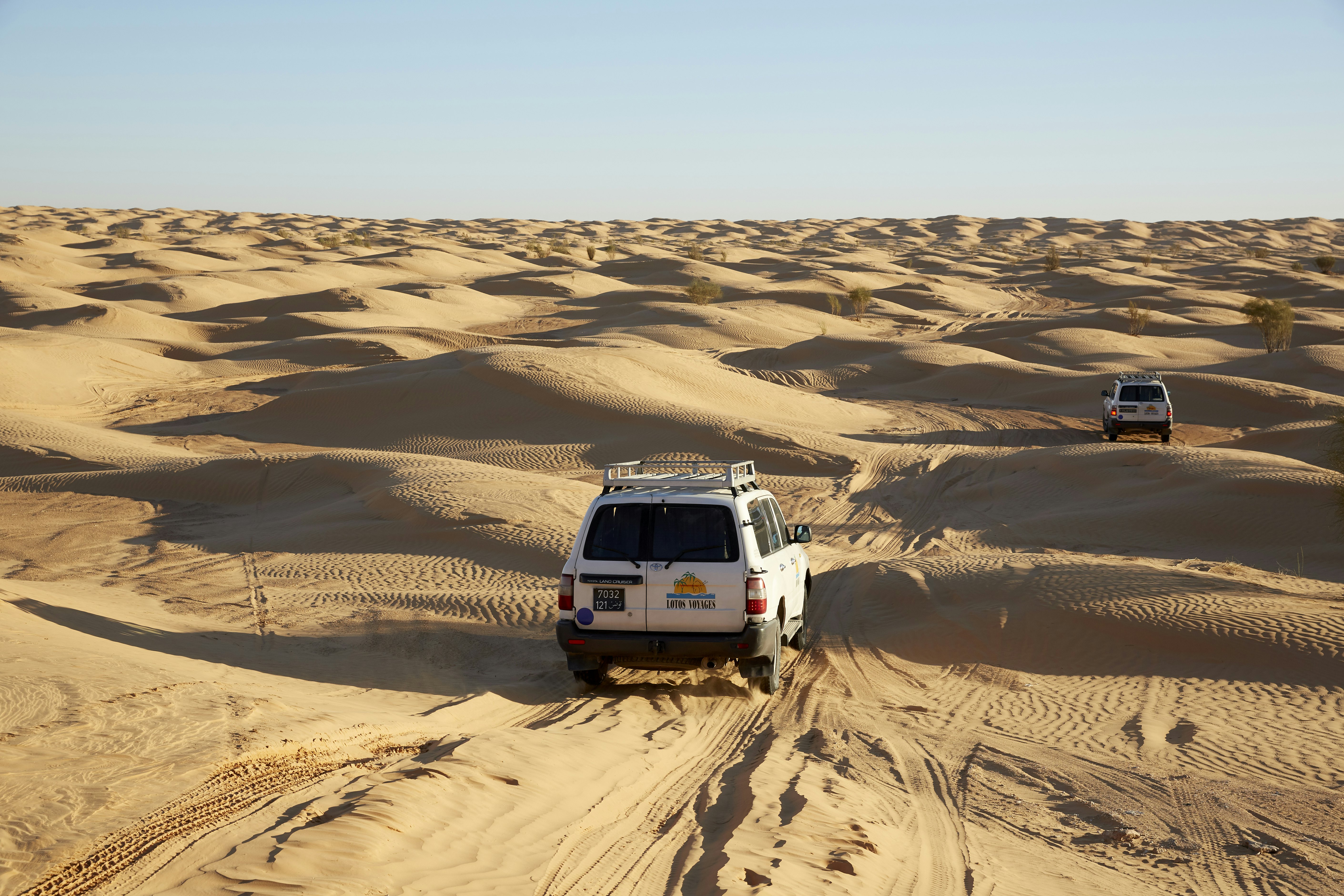 Vehicles crossing the desert near Douz in Tunisia.