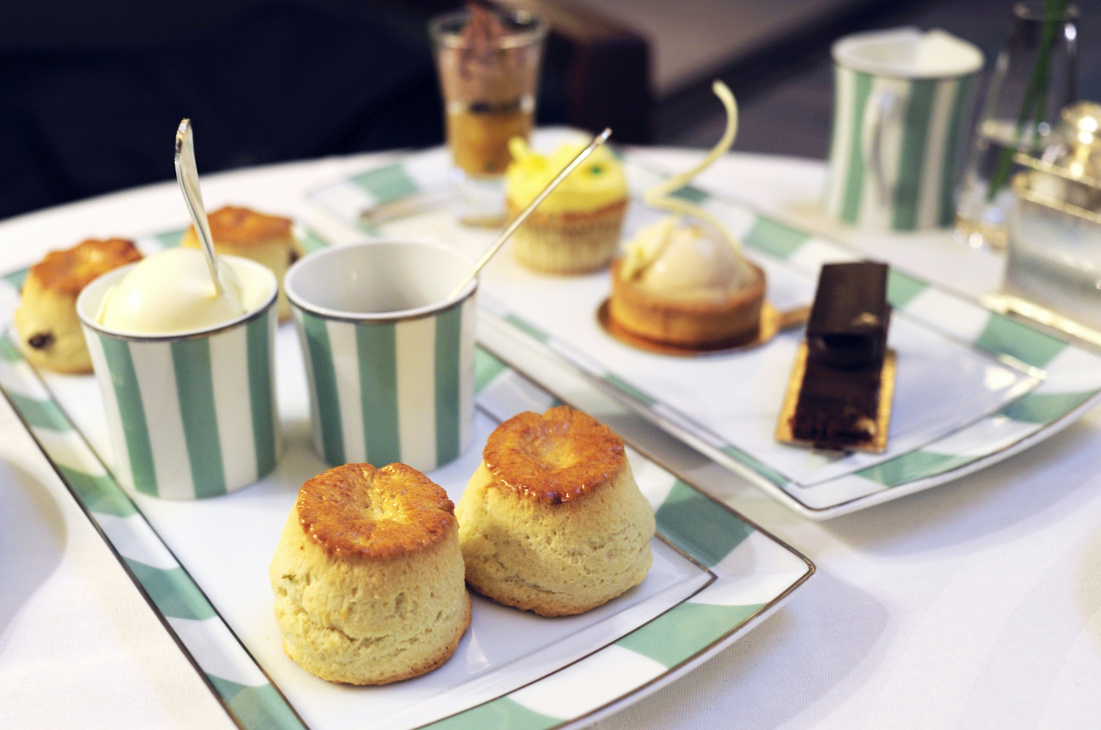 Apple scones and other desserts during afternoon tea at The Foyer, Claridge's Hotel, London.