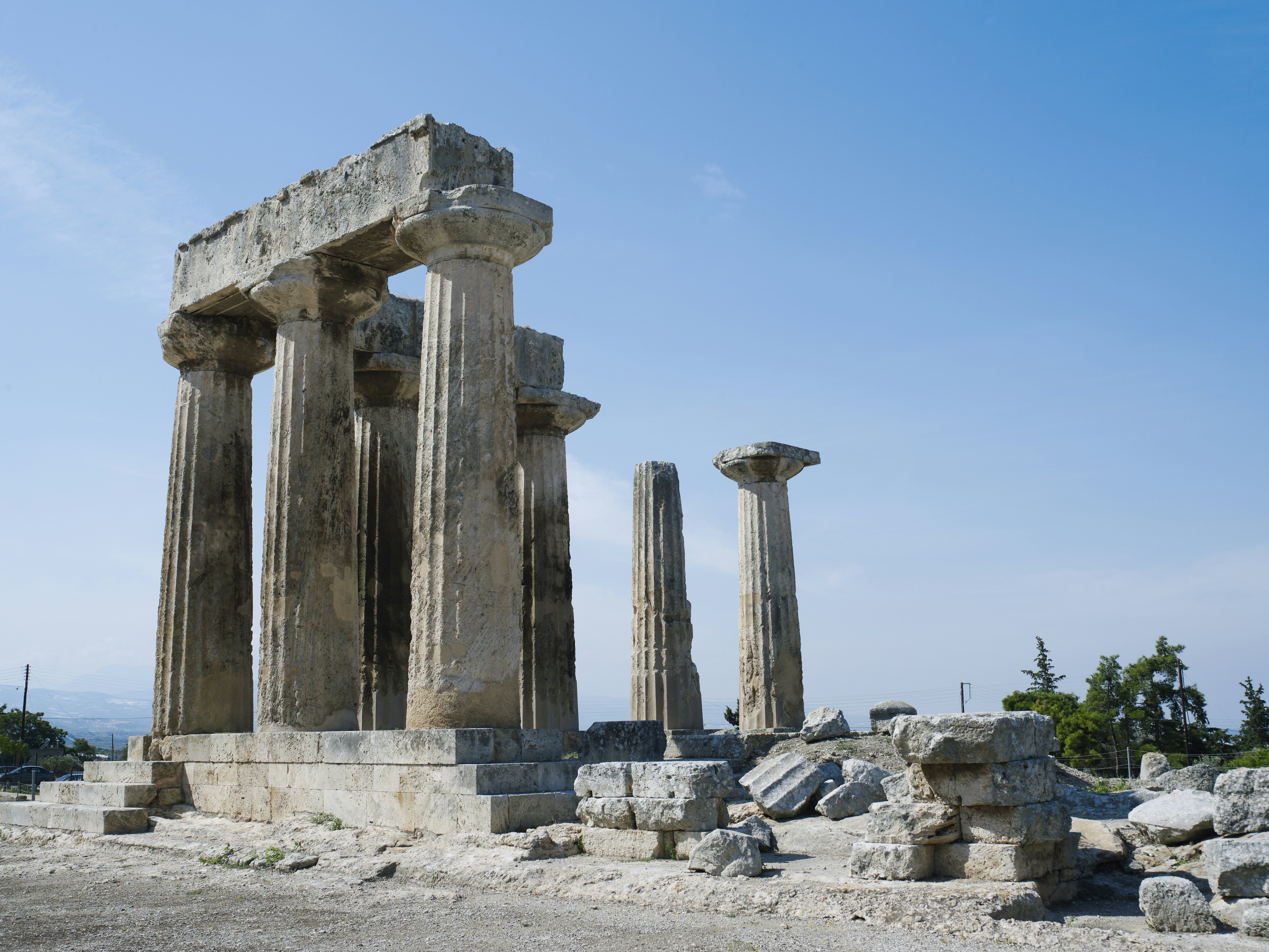 Ruins of a temple with columns against a blue sky