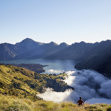 Man sitting at the still-active Mount Rinjani on the northern coastline of Lombok features Segara Anak crater lake and hot springs.
Lonely Planet Traveller Magazine, Issue 104, August 2017, Great Escape, Bali, Lombok