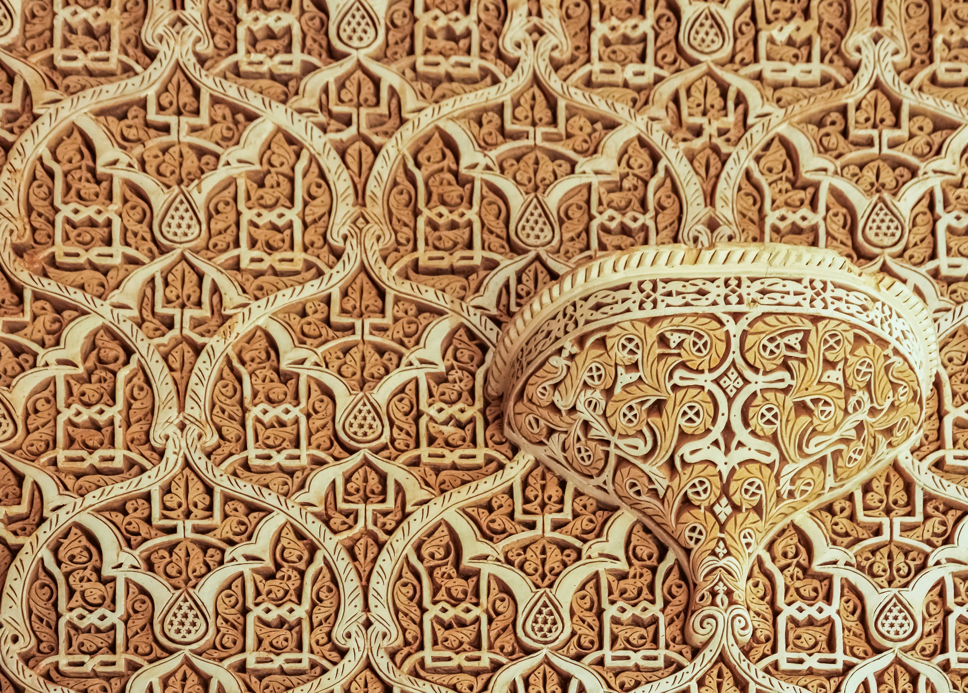 intricate spiral and vase-shaped carvings