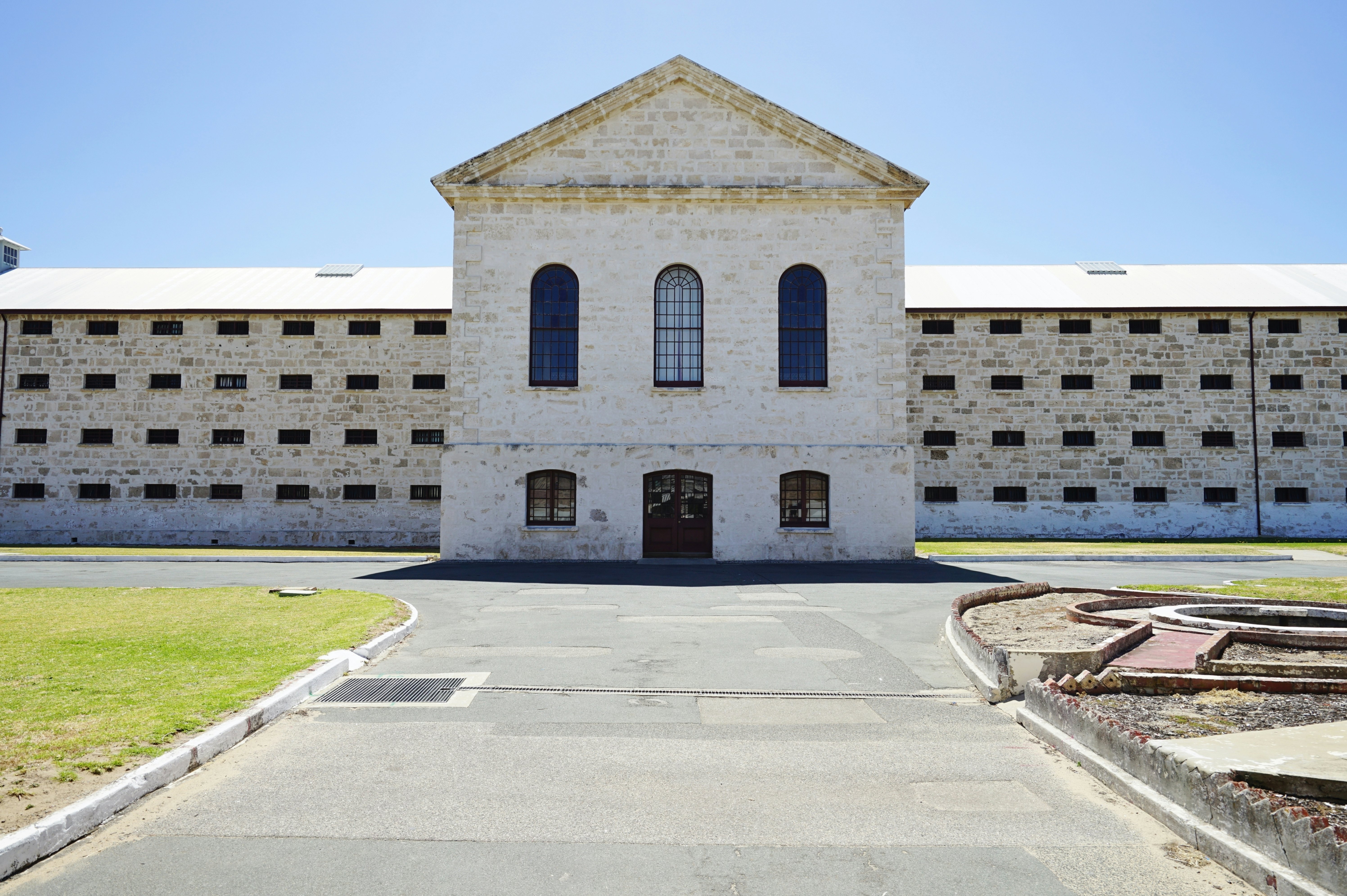 The brick exterior of a large prison building.