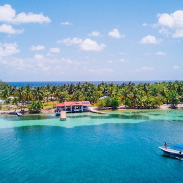 Aerial photo of tropical island South Water Caye in Belize with boat docking License Type: media Download Time: 2023-07-20T20:51:34.000Z User: Norma.PrauseBrewer_LonelyPlanet Is Editorial: No purchase_order: