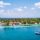 Aerial photo of tropical island South Water Caye in Belize with boat docking License Type: media Download Time: 2023-07-20T20:51:34.000Z User: Norma.PrauseBrewer_LonelyPlanet Is Editorial: No purchase_order: