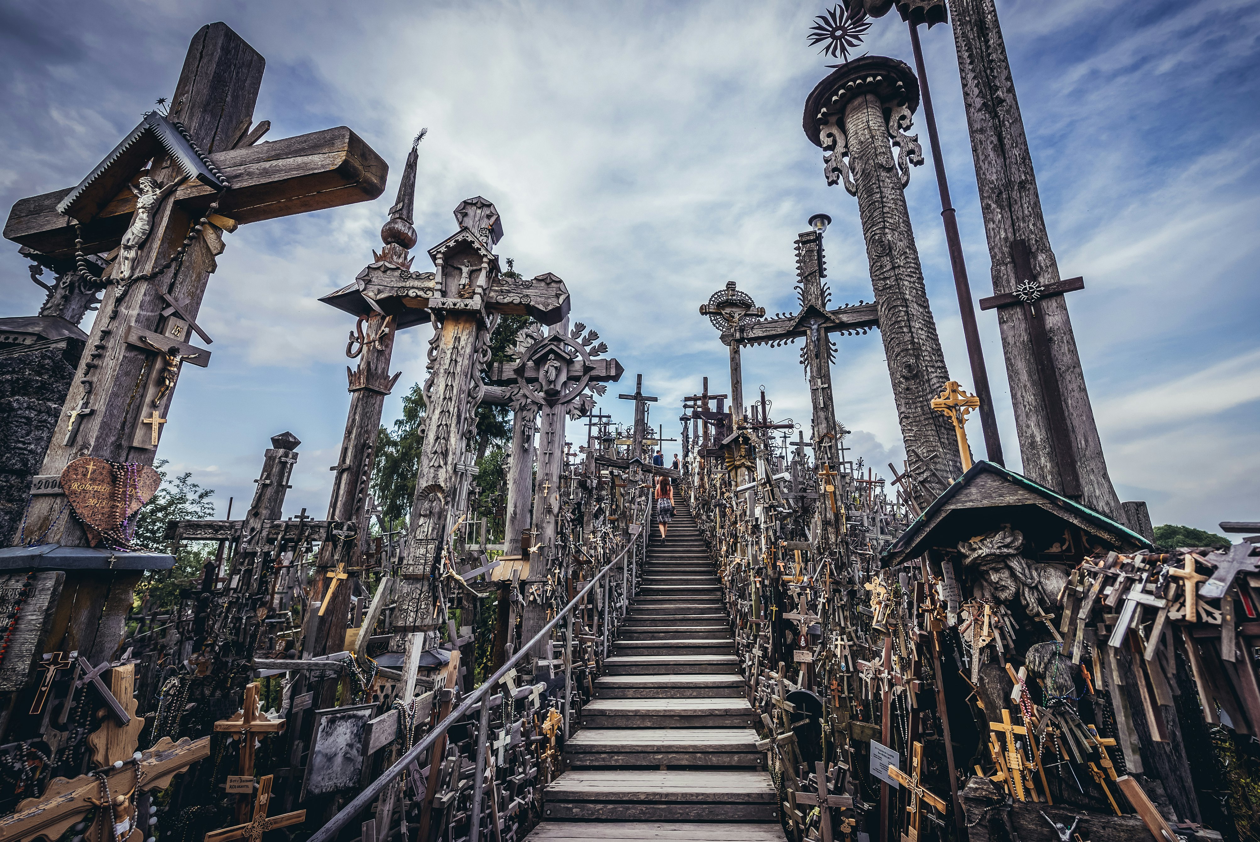 Wooden stairs among dozens of crosses