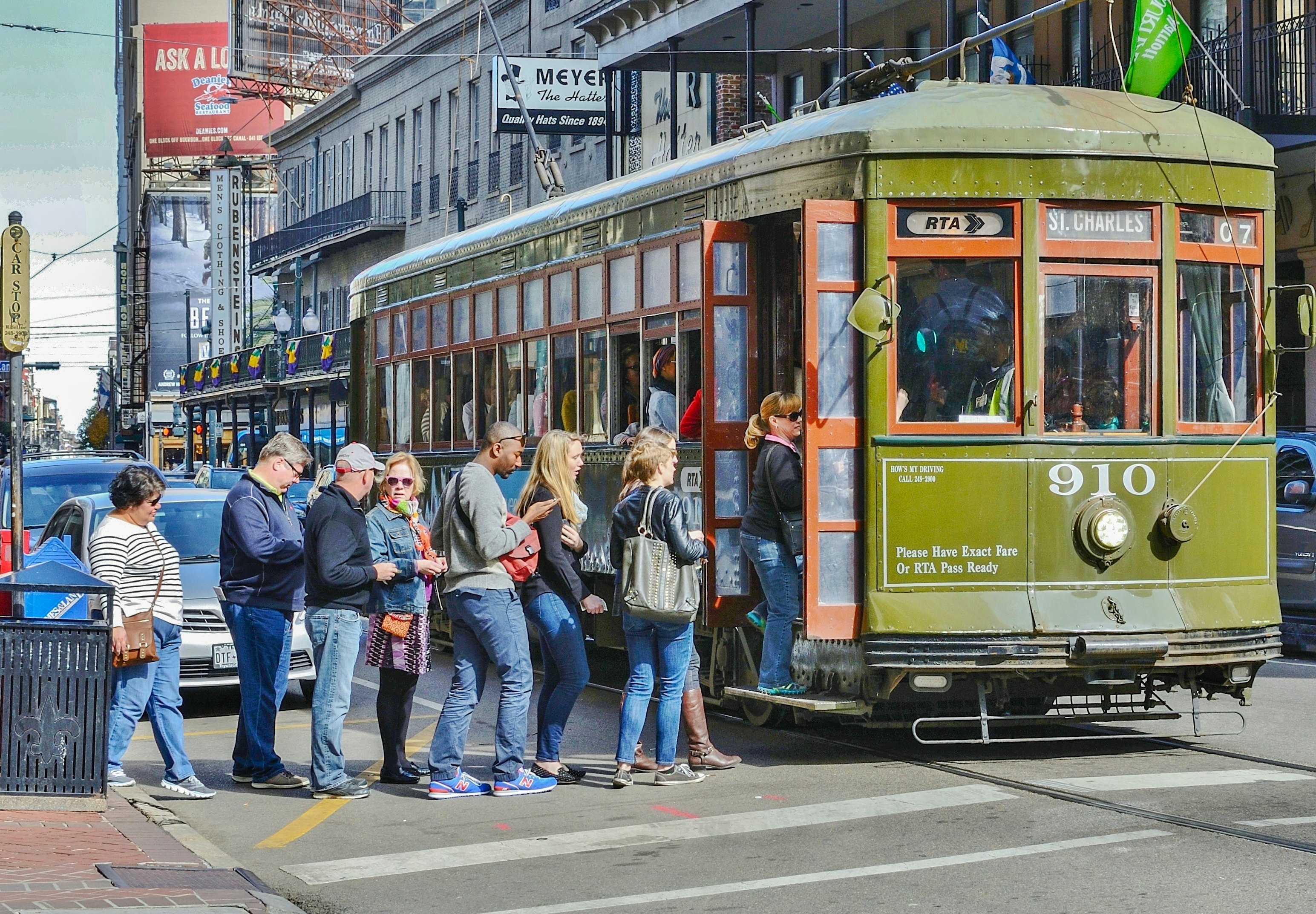 People in line to board a streetcar in New Orleans, Louisiana, USA.