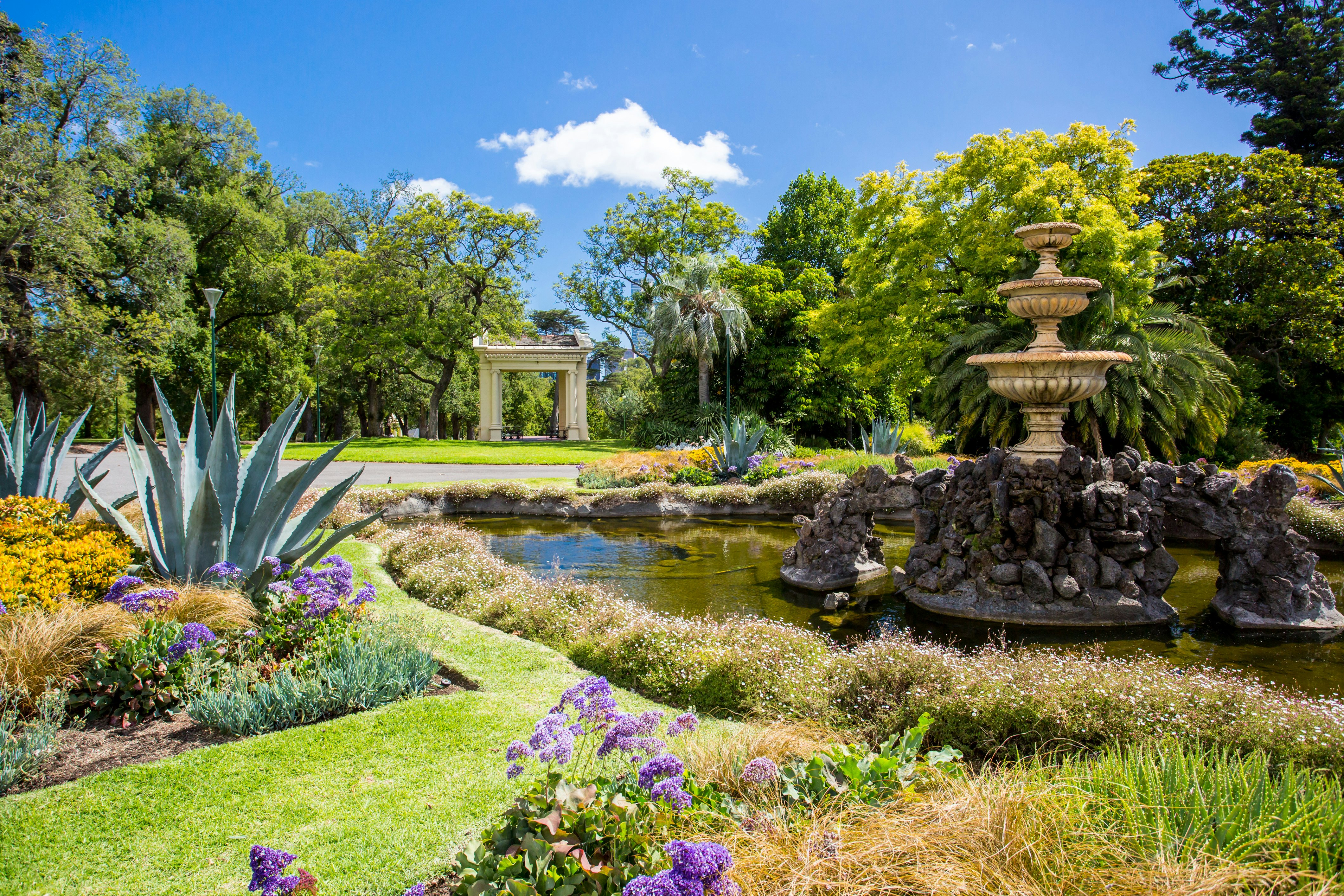 Fitzroy Gardens with colorful flowers and trees all around