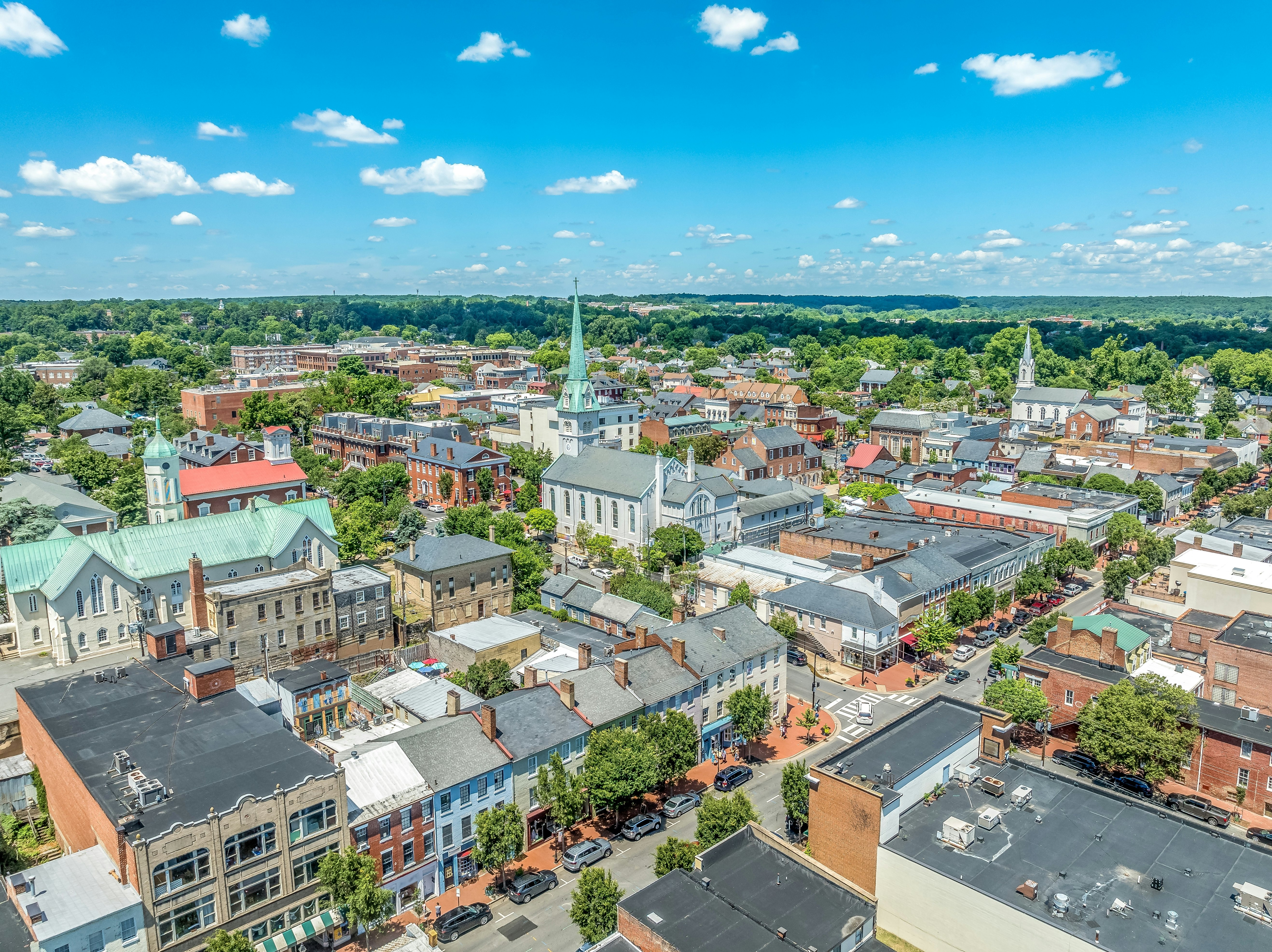 Aerial view Fredericksburg Virginia with Circuit Court building , historic business district, Baptist church, Chatham bridge over Rappahannock River