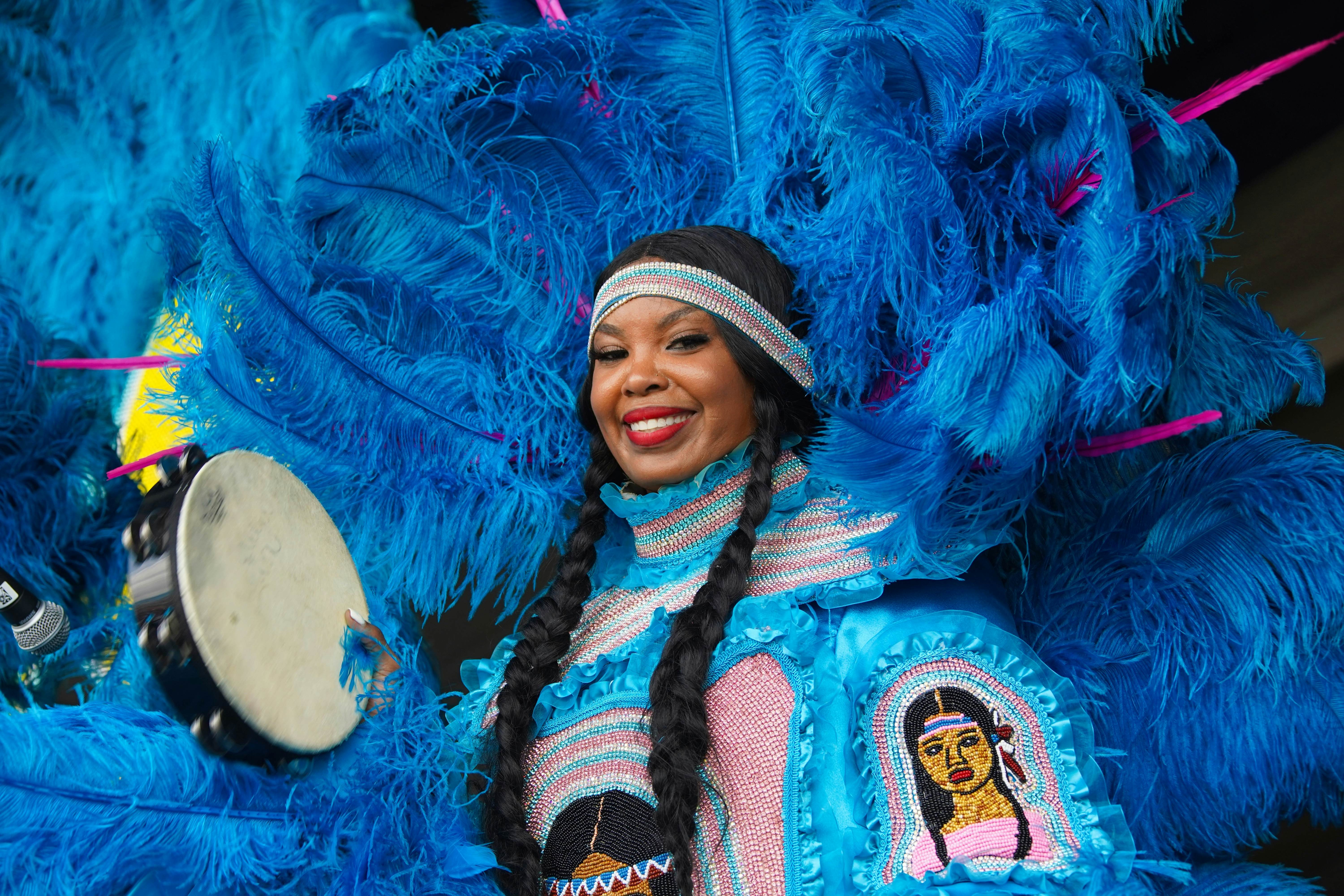 New Orleans, Louisiana - April 27, 2024: A woman from the Creole Wild West Mardi Gras Indians performs on stage at the 2024 New Orleans Jazz and Heritage Festival., License Type: media, Download Time: 2025-05-29T19:47:08.000Z, User: lonelyplanetmedia, Editorial: true, purchase_order: 65050 - Digital Destinations and Articles, job: Global Publishing WIP, client: Global Publishing WIP, other: Peterson Haggarty // SS Comp Ingestion