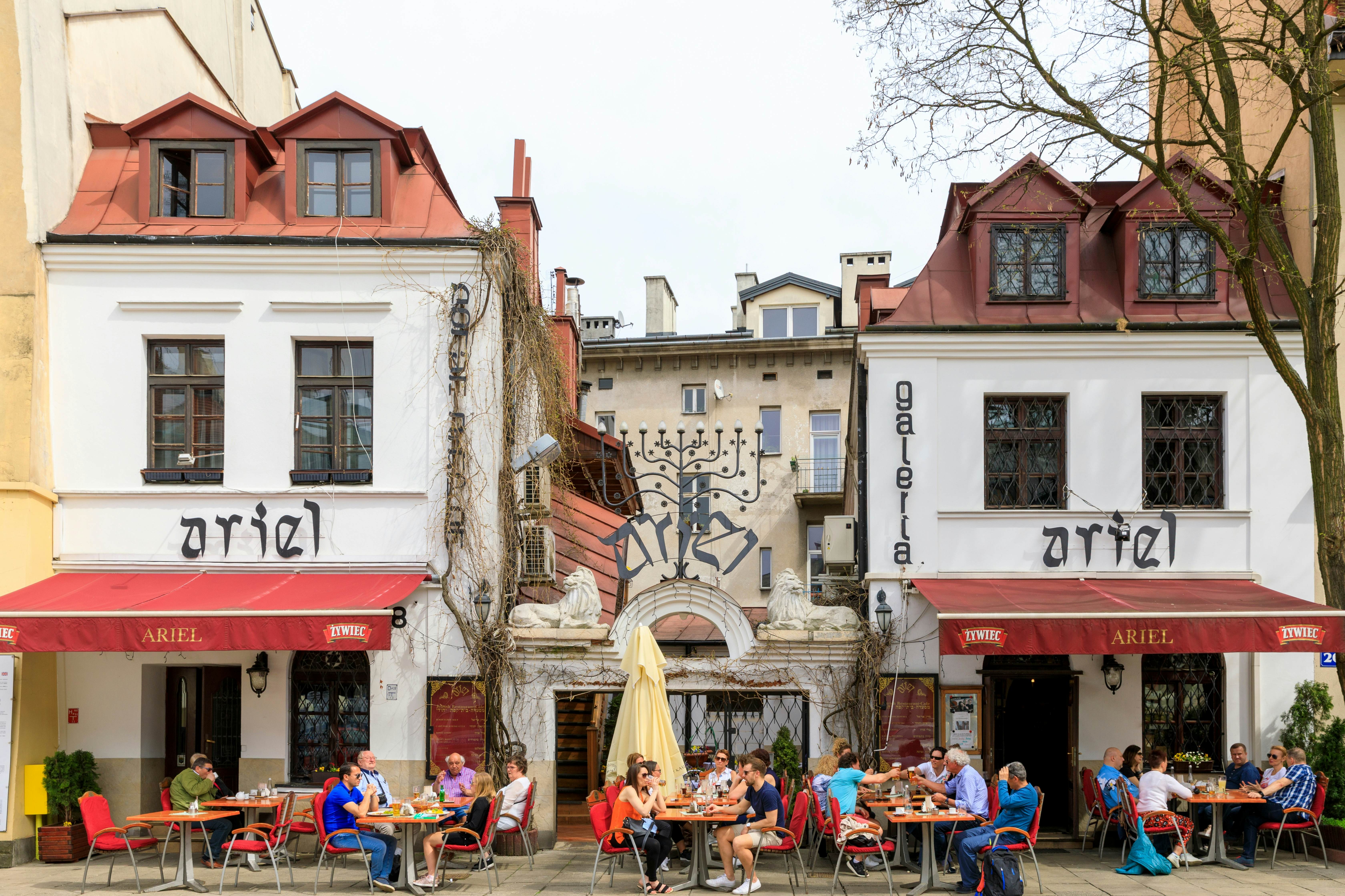 whit buildings with red roofs and a tan building behind