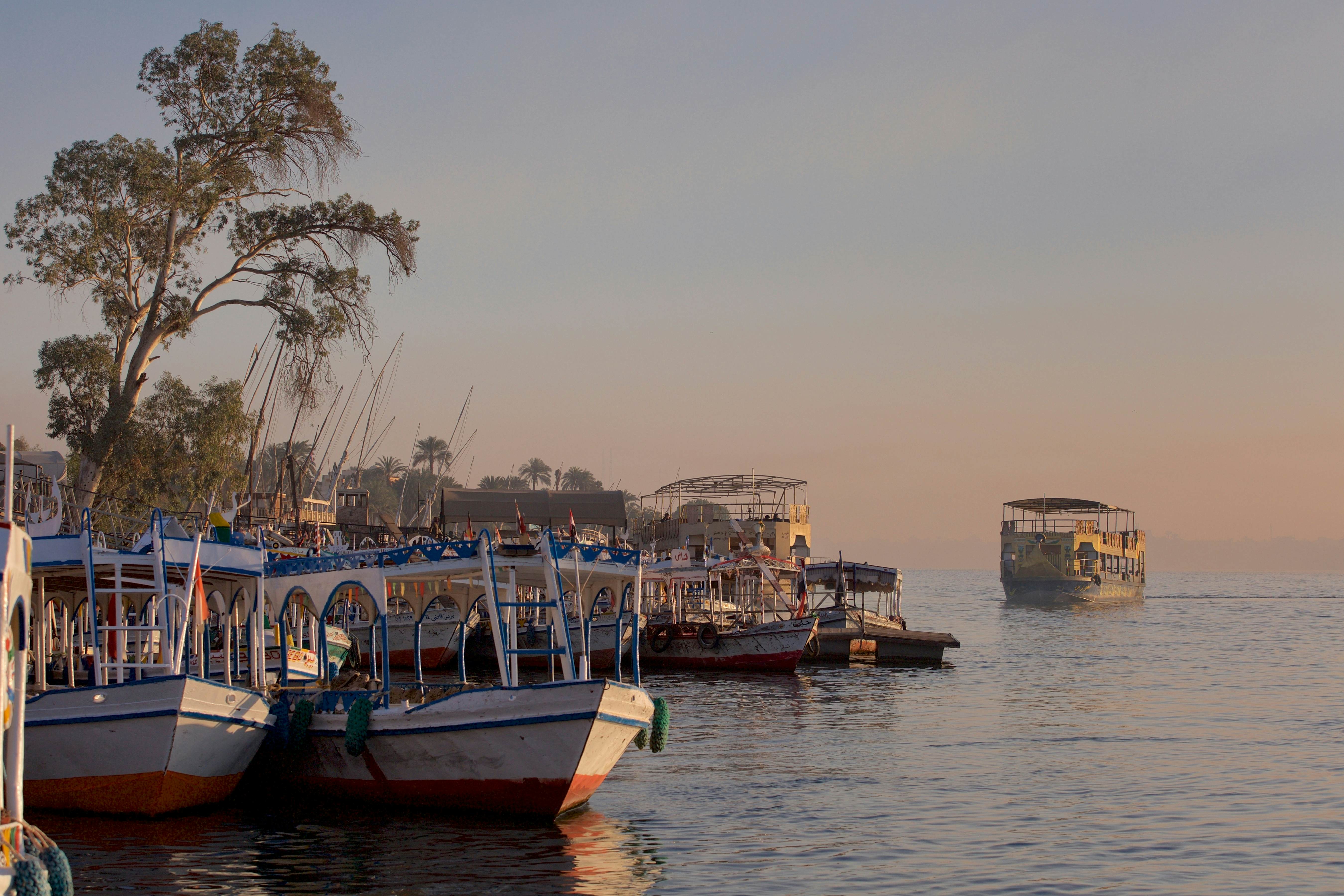 Sunrise on the west bank of the Nile in Luxor, at the public ferry and tourist boats. Egypt, Luxor 05.03.2016, License Type: media, Download Time: 2025-11-07T15:48:47.000Z, User: katelyn.perry_lonelyplanet, Editorial: true, purchase_order: 65050 - Digital Destinations and Articles, job: wip, client: wip, other: Katelyn Perry