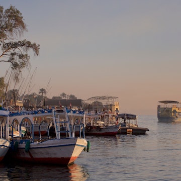 Sunrise on the west bank of the Nile in Luxor, at the public ferry and tourist boats. Egypt, Luxor 05.03.2016, License Type: media, Download Time: 2025-11-07T15:48:47.000Z, User: katelyn.perry_lonelyplanet, Editorial: true, purchase_order: 65050 - Digital Destinations and Articles, job: wip, client: wip, other: Katelyn Perry