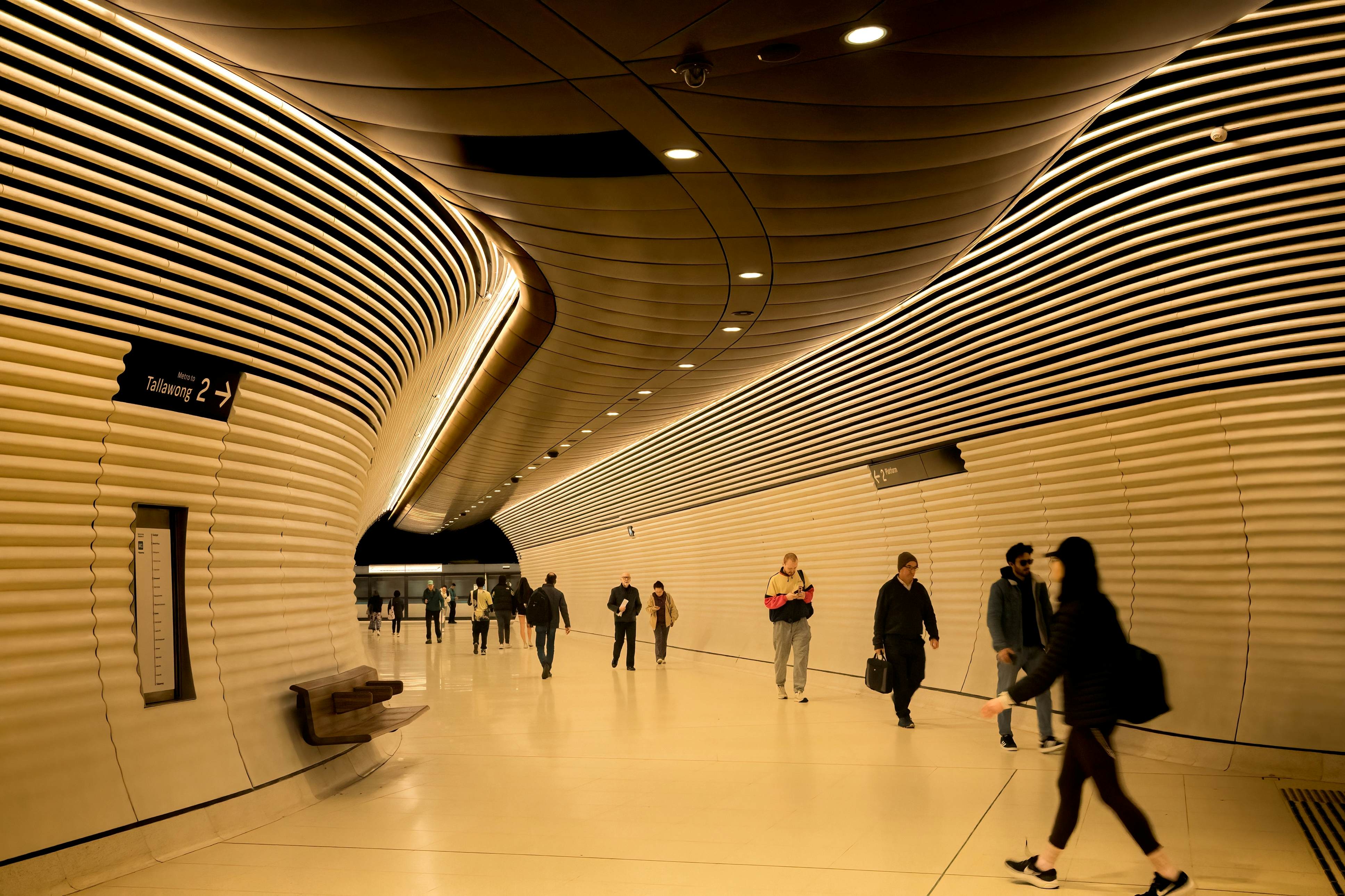 Sydney, NSW, Australia. July 16, 2025. Commuters heading along one of the concourses in the Gadigal metro station in Sydney; Shutterstock ID 2661691433; purchase_order:65050 - Digital Destinations and Articles; job:Lonely Planet; client:How to get around in Sydney; other:Sasha Brady
2661691433