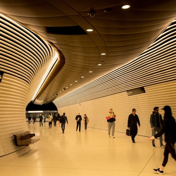 Sydney, NSW, Australia. July 16, 2025. Commuters heading along one of the concourses in the Gadigal metro station in Sydney; Shutterstock ID 2661691433; purchase_order:65050 - Digital Destinations and Articles; job:Lonely Planet; client:How to get around in Sydney; other:Sasha Brady
2661691433