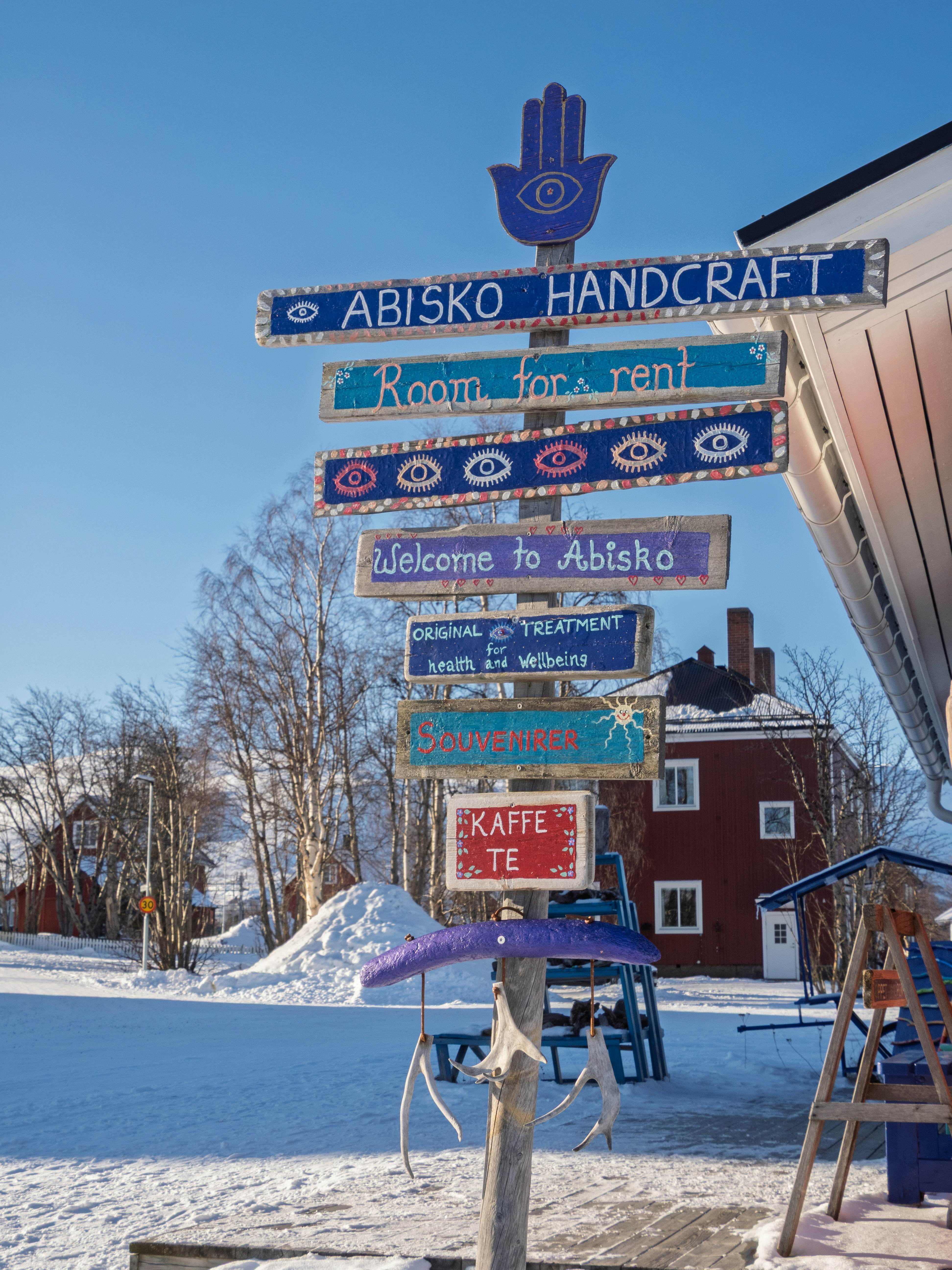  A quirky, handpainted signpost, pointing visitors to local shops and services.