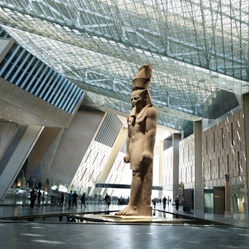 Cairo, Egypt- September 27th 2025-Massive Ancient Egyptian Ramses II Statue Standing Under the Glass Skylight of The Grand Egyptian Museum., License Type: media, Download Time: 2025-12-08T14:34:38.000Z, User: clairenaylor, Editorial: true, purchase_order: 65050 - Digital Destinations and Articles, job: Online editorial, client: Guide to Grand Egyptian Museum, other: Claire Naylor