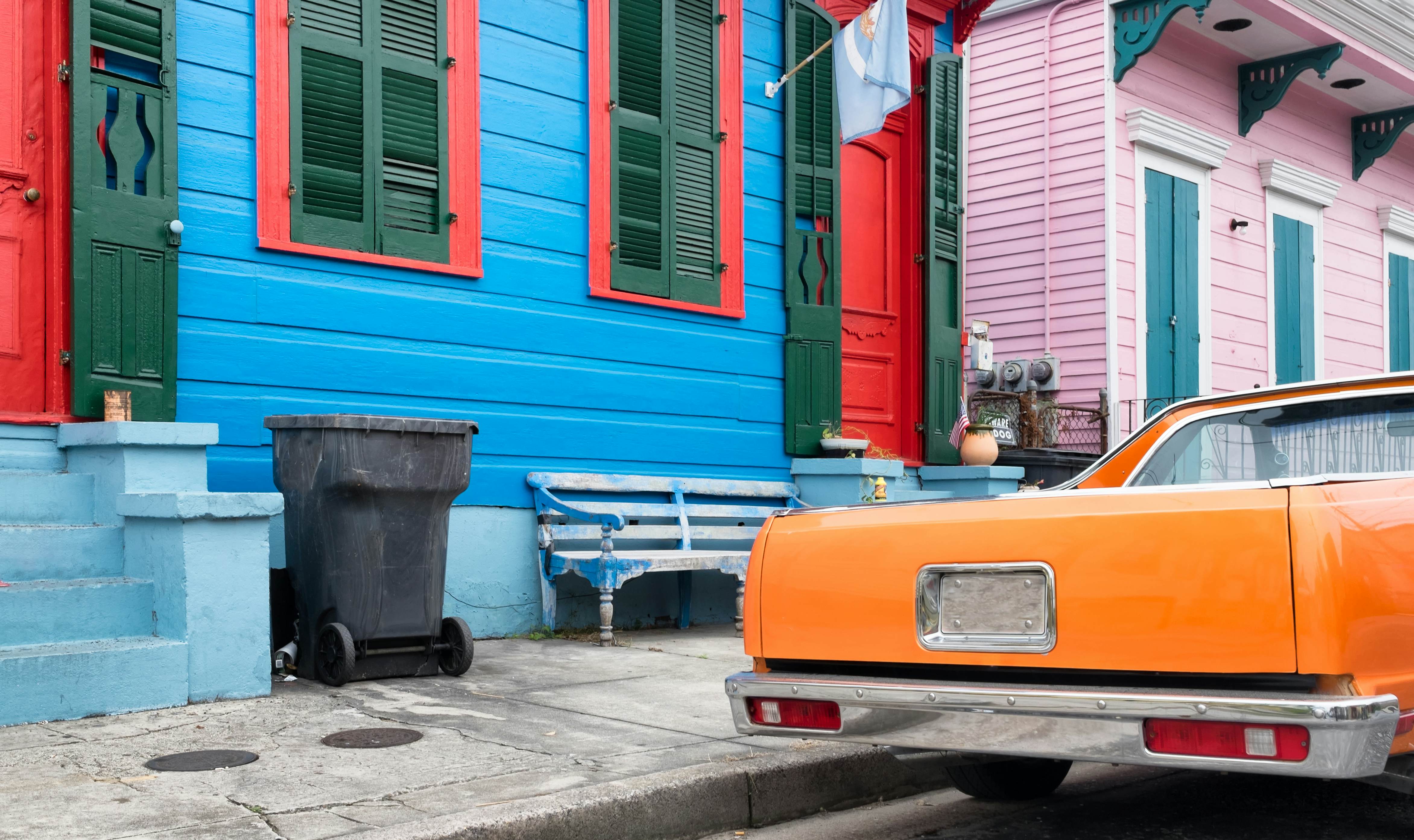 New Orleans colorful vintage painted houses and a classic orange car parked in front. Typical shotgun architectural style of homes seen in the historic neighborhoods., License Type: media, Download Time: 2025-05-29T14:40:52.000Z, User: lonelyplanetmedia, Editorial: false, purchase_order: 65050 - Digital Destinations and Articles, job: Global Publishing WIP, client: Global Publishing WIP, other: Peterson Haggarty // SS Comp Ingestion