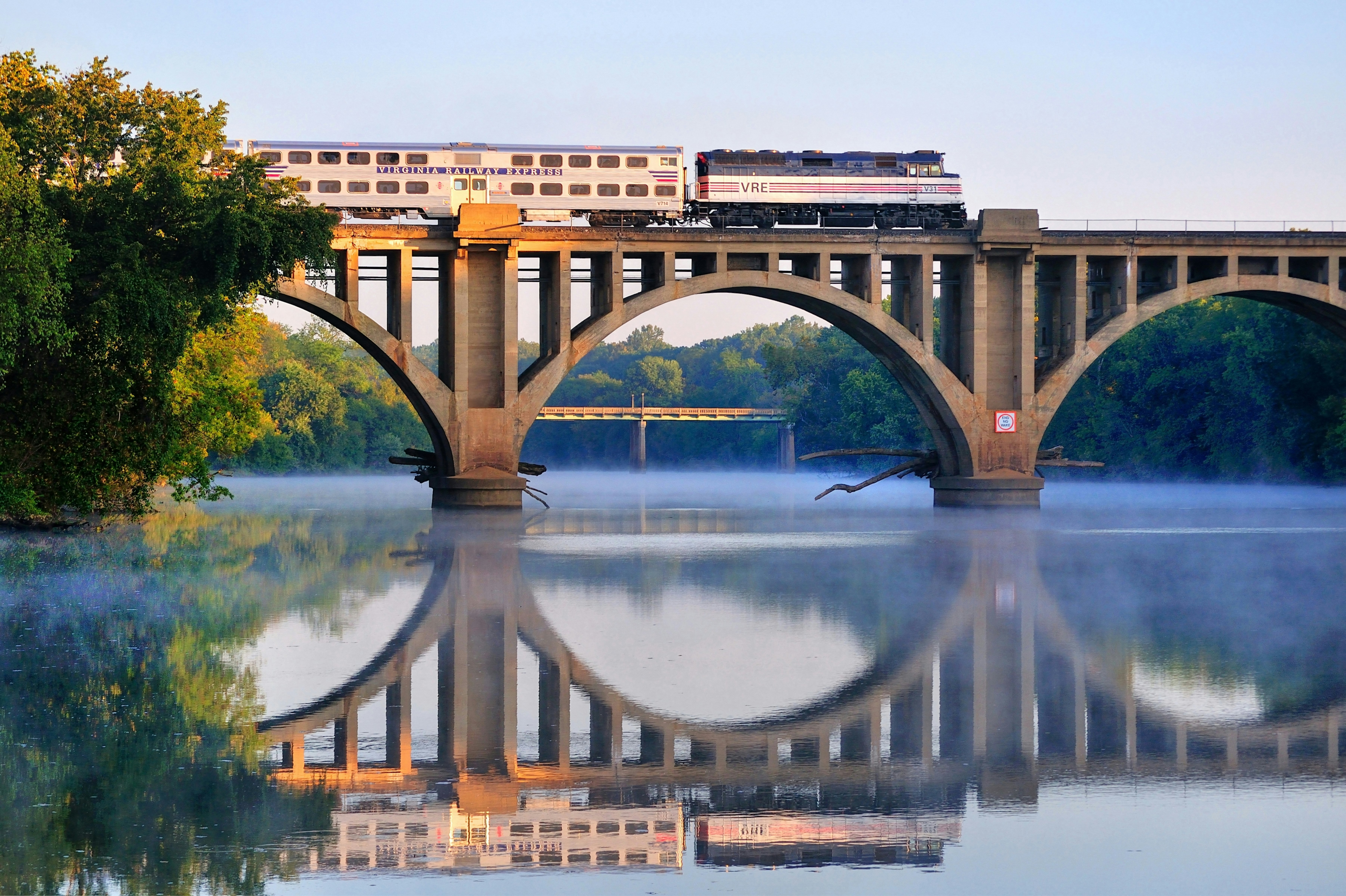 An early morning Virgina Railway Express commuter train passes over the Rappahannock River en route to Washington, D.C