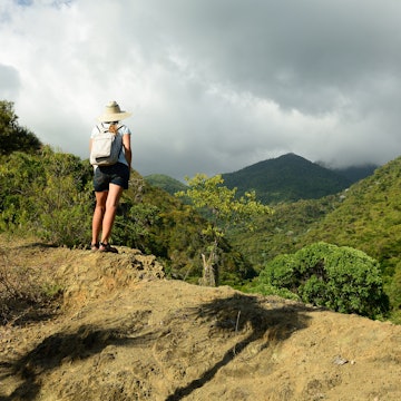 Tourist on a trail to Pico Turquino mountain.
754600705
hike, lifestyle, activity, girl, leisure, extreme, summer, sport, view, young, female, freedom, backpacker, backpack, hiker, outdoor, hiking, highlands, las cuevas, pico turquino, santiago de cuba, sierra maestra, adventure, background, beautiful, climb, clouds, coast, country, countryside, cuba, cubana, expedition, green, hill, landmark, landscape, mountain, nature, palm, people, plants, scene, scenic, stone, top, tourist, trail, travel, woman