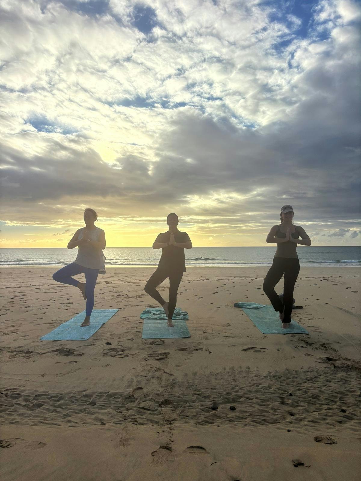Sunrise yoga on Jandía beach in Fuerteventura.