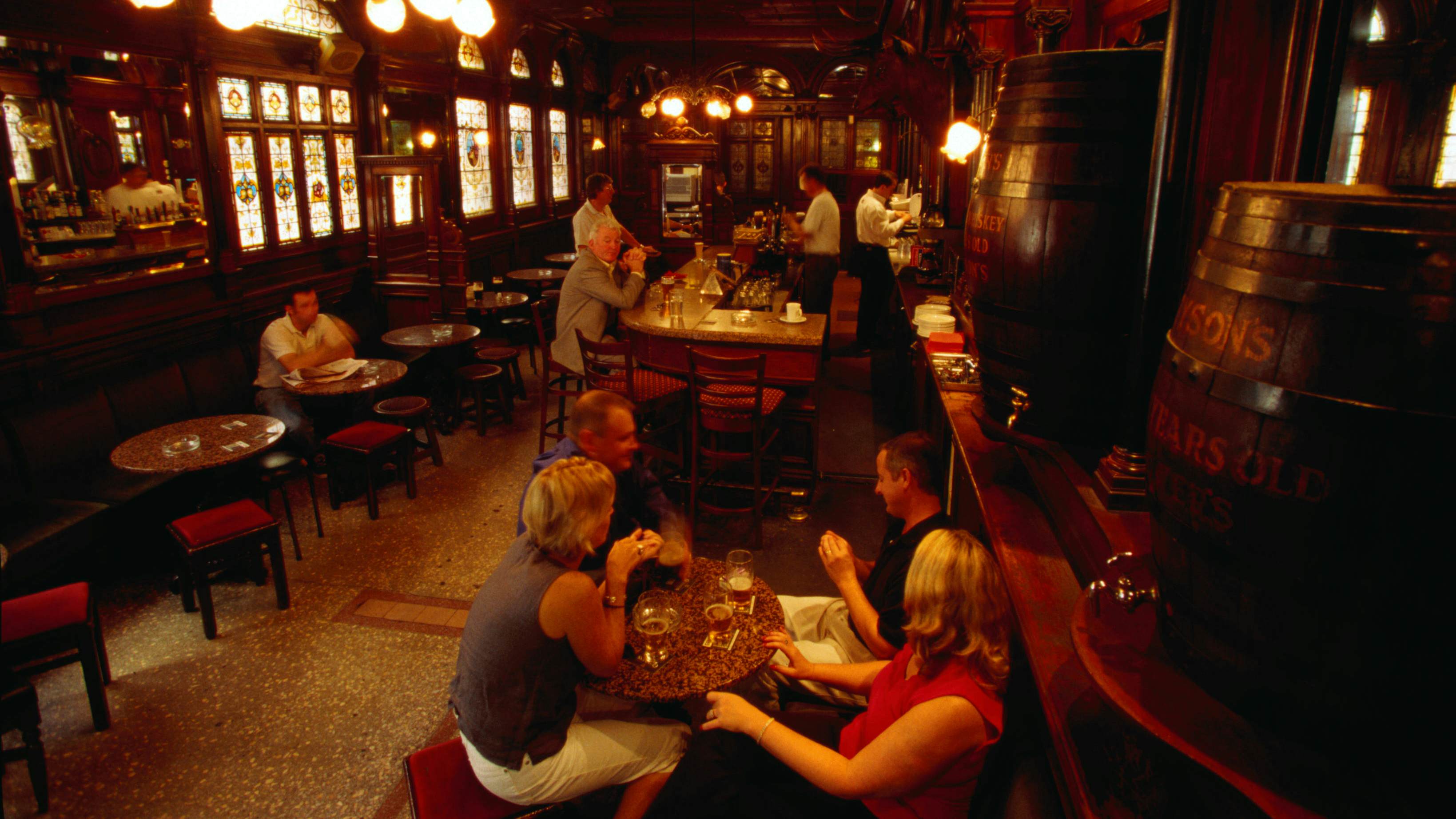 Dublin, County Dublin, Republic of Ireland, Europe
148560821
alcohol, beer, beverage, food, food & drink, interior, people, sit, Europe, Ireland, Republic of Ireland, County Dublin, Dublin
People drinking inside the Stag's Head pub in Dublin, Ireland, with subdued lighting.