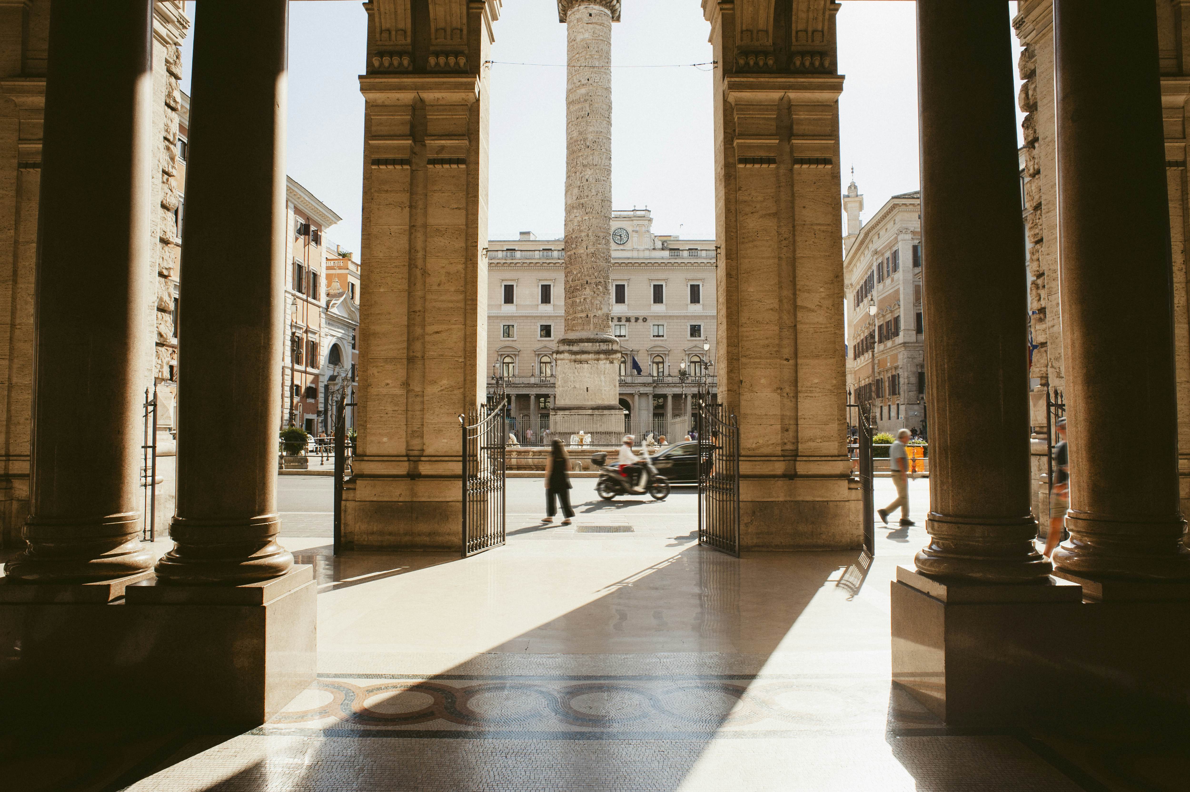 GettyImages-2165784697.jpg
The monument of Trajan's Column seen through architectural columns