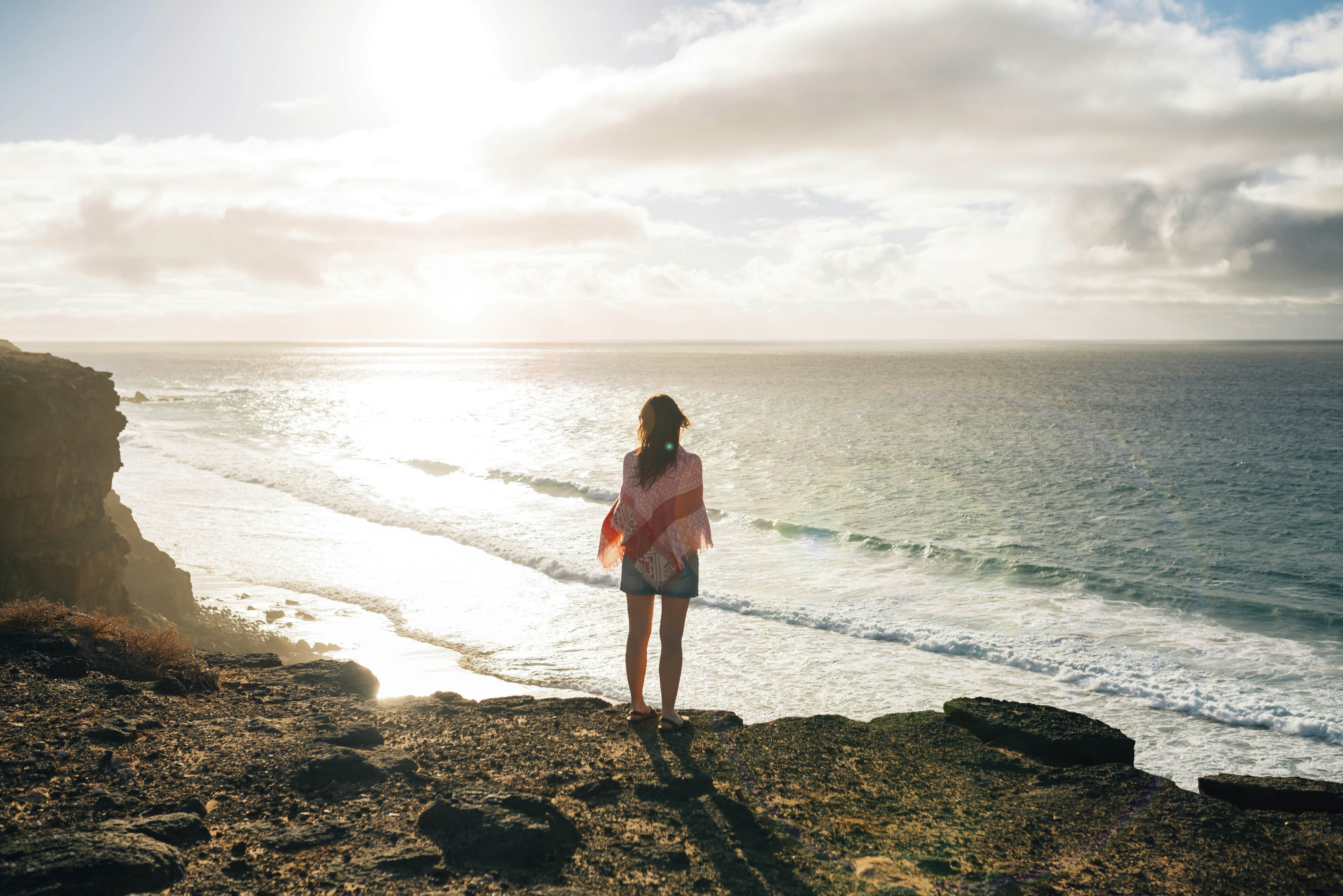 GettyImages-634468441.jpg
Spain, Fuerteventura, El Cotillo, back view of woman looking to the sea by sunset