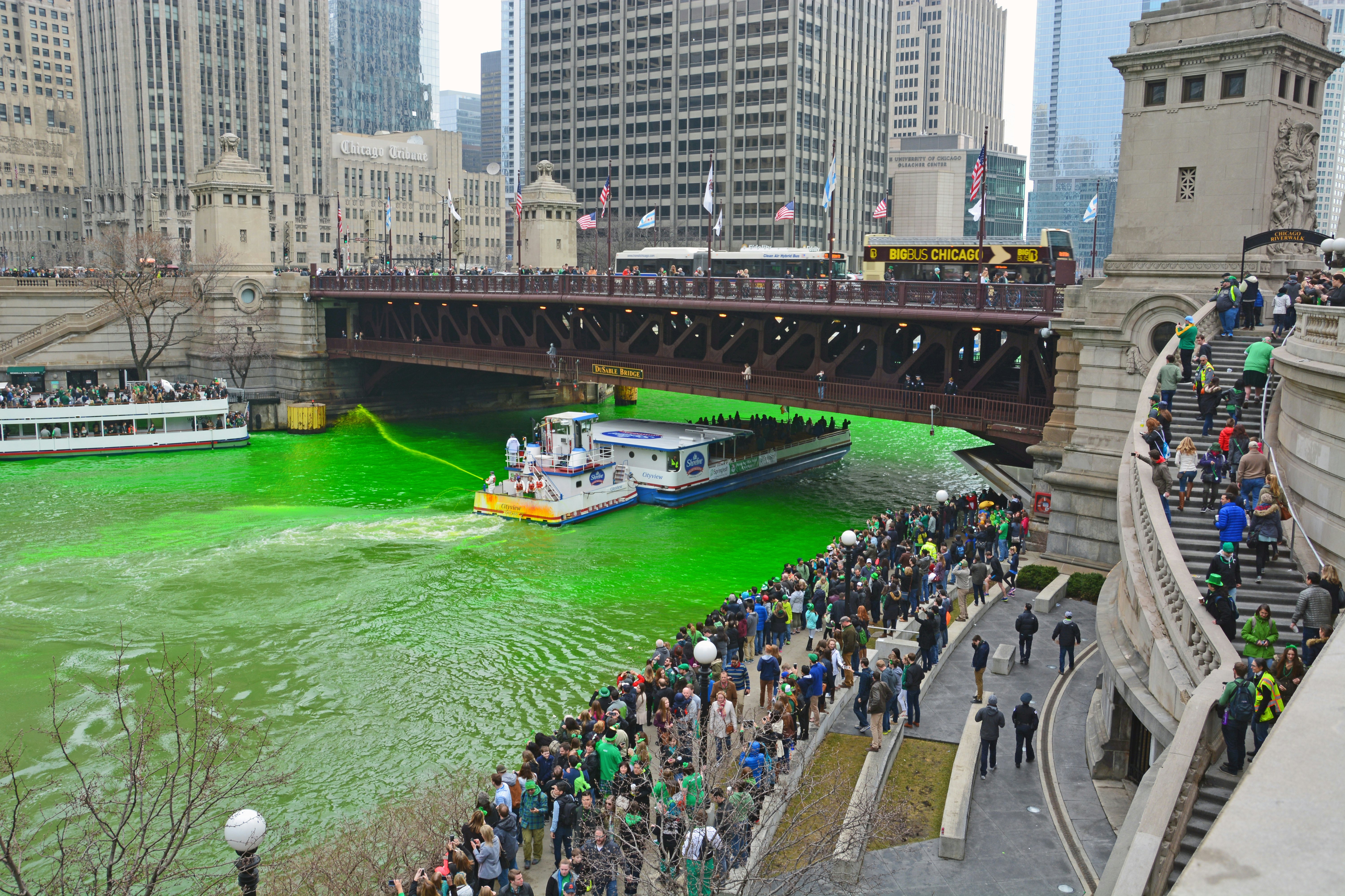 Chicago, Illinois / United States - 03-12-2016: The annual St. Patrick's Day tradition of dying the river green brings out large crowds that line the River Walk in downtown Chicago.  License Type: media  Download Time: 2022-08-10T00:30:58.000Z  User: mvm_lonelyplanet  Is Editorial: Yes  purchase_order: