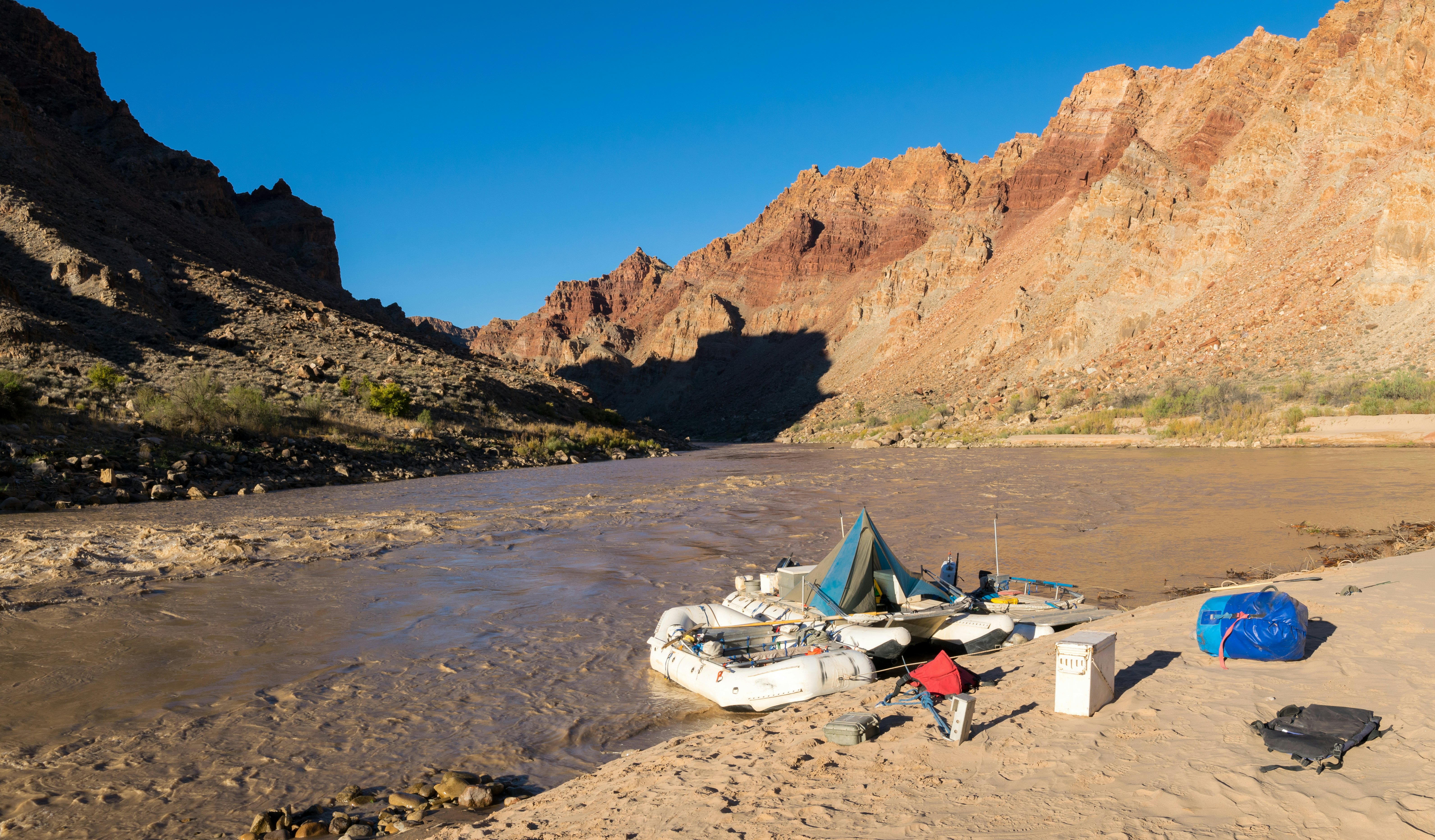 River rafts wait for passengers on the Colorado River just above the entrance to Cataract Canyon in Canyonlands National Park.