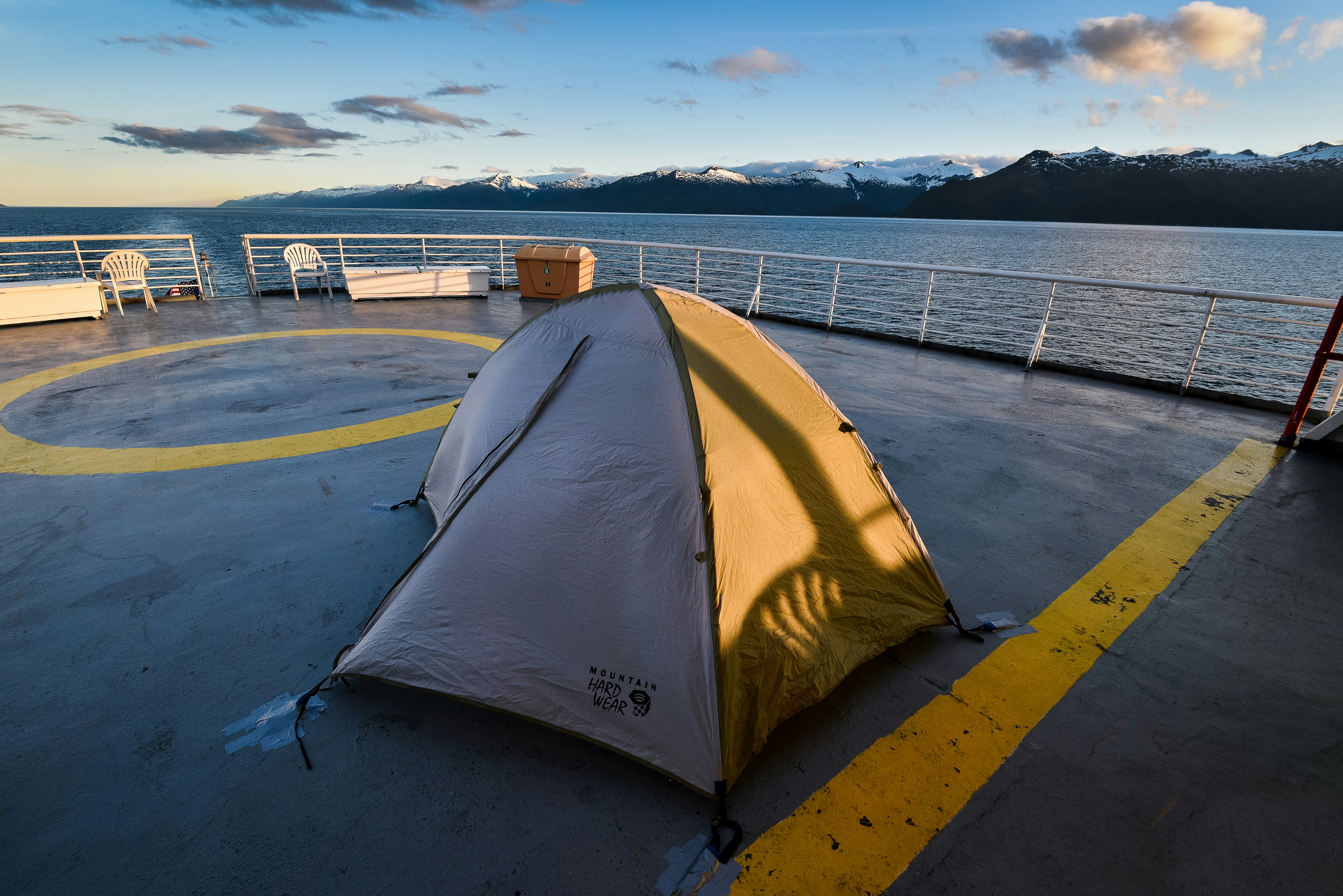 A passenger's tent taped to the upper deck on an Alaskan ferry.