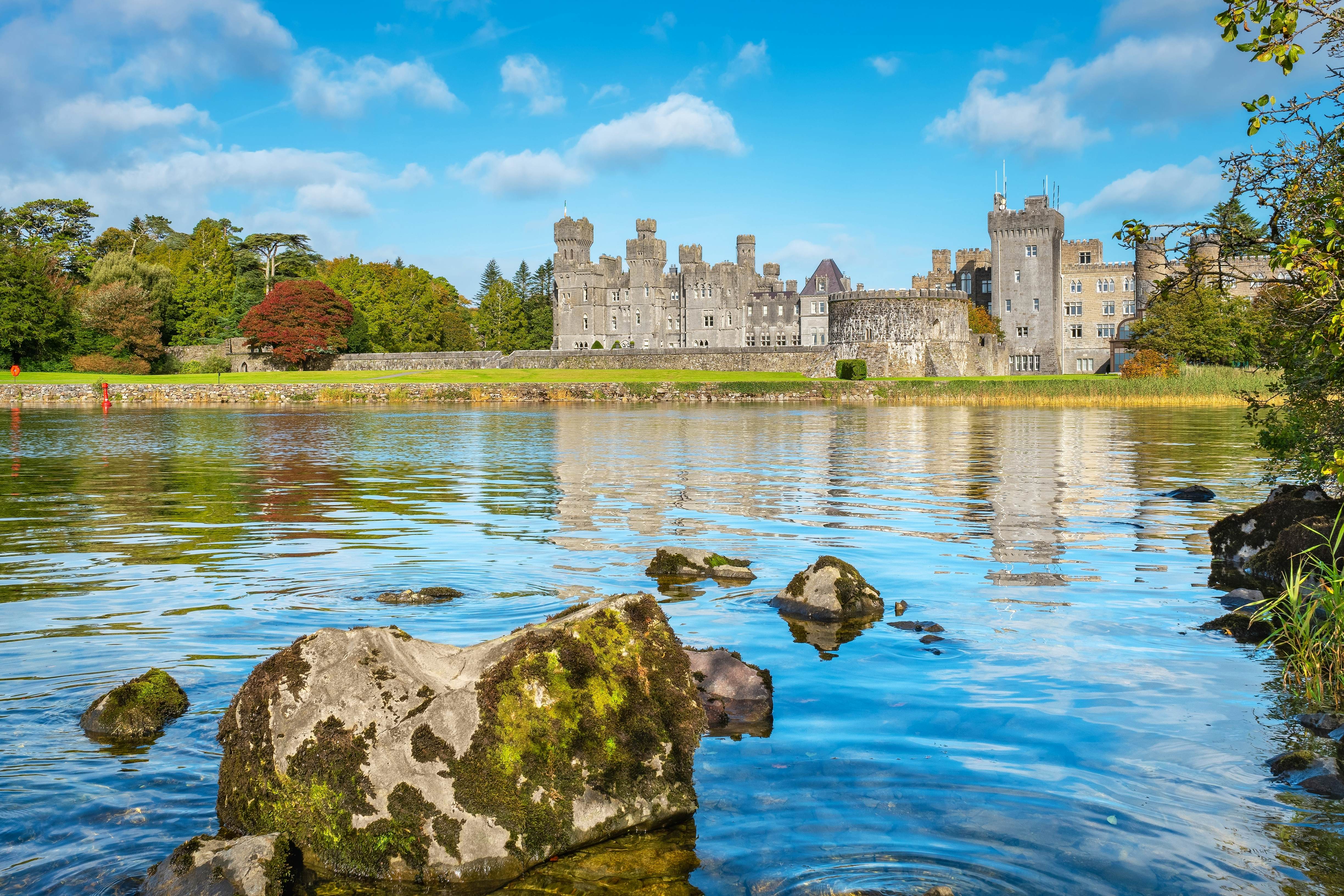 View of Lough Corrib coastline with Ashford Castle in the background. Cong, County Mayo, Ireland  License Type: media  Download Time: 2023-08-30T13:08:47.000Z  User: aniabartoszek  Is Editorial: No  purchase_order:   