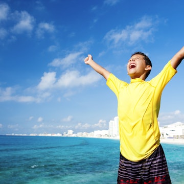 A 10-year old boy on vacation at the beach with his arms in the air letting out a victory yell. I love it!
157432810
Mouth Open, Candid, Travel, Tourism, Leisure Activity, Elementary Age, Arms Outstretched, Boys, Copy Space, Screaming, Eyes Closed, 10-11 Years, Child, Triumph, Arms Raised, Shouting, Fun, One Person, Success, Getting Away From It All, Relaxation, Enjoyment, Excitement, Yellow, Vacations, Lifestyles, Childhood, Outdoors, Waist Up, Horizontal, Positive Emotion, Recreational Pursuit, People, Cancun, Summer, Beach, Swimwear, Concepts And Ideas, Lifestyle, Travel Locations, Feelings And Emotions, Babies And Children, Beaches, Victory