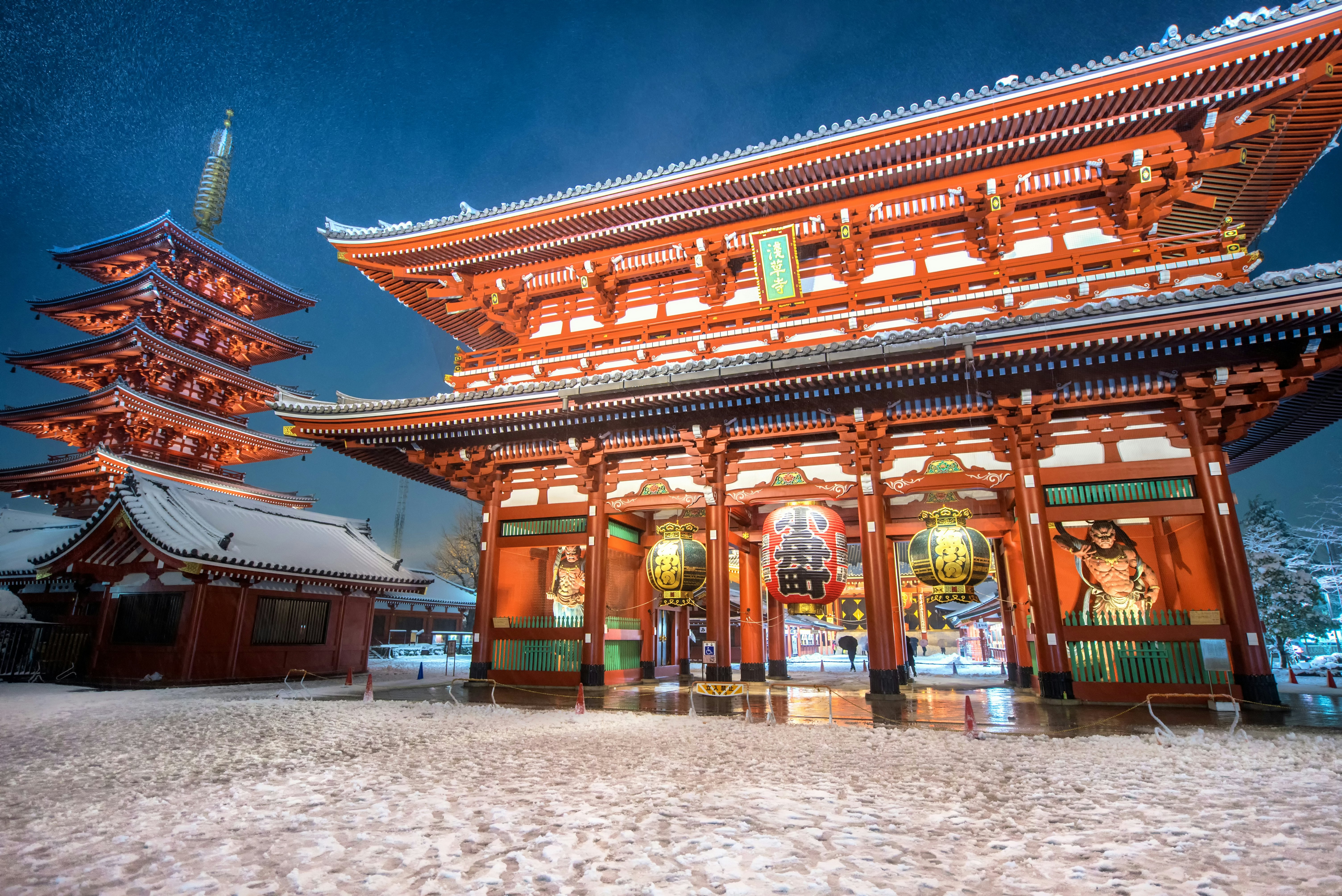 Snow around the Sensoji-ji temple in Asakusa, Japan, at night.
