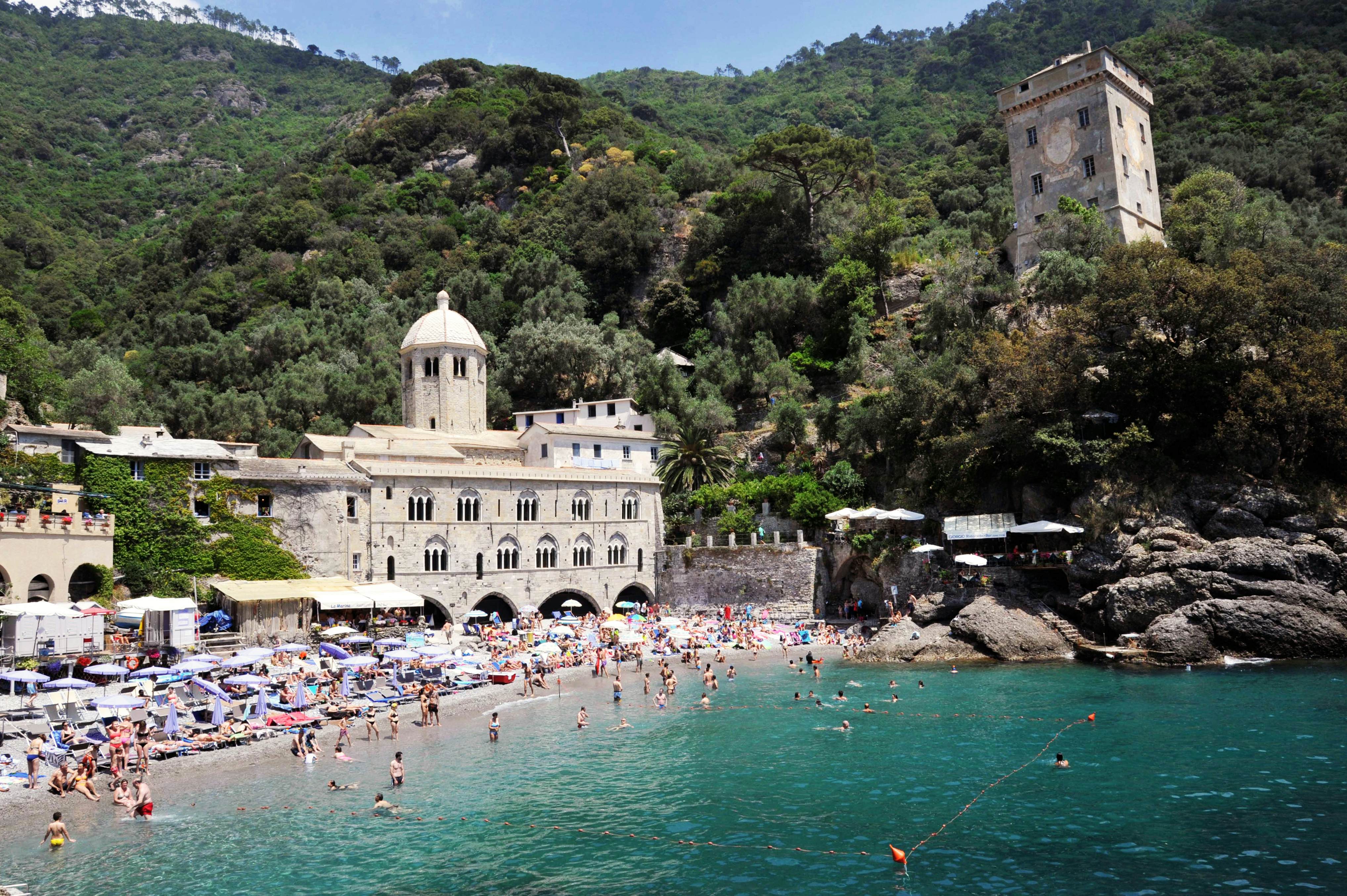 San Fruttuoso abbey, Camogli, Liguria, Italy, June/06/2017, tourists at the beach, License Type: media, Download Time: 2024-12-01T16:11:23.000Z, User: comptonsheldon109, Editorial: true, purchase_order: 56530 - Guidebooks, job: Global Publishing WIP, client: Pocket Genoa & Cinque Terre 2, other: Compton Sheldon
