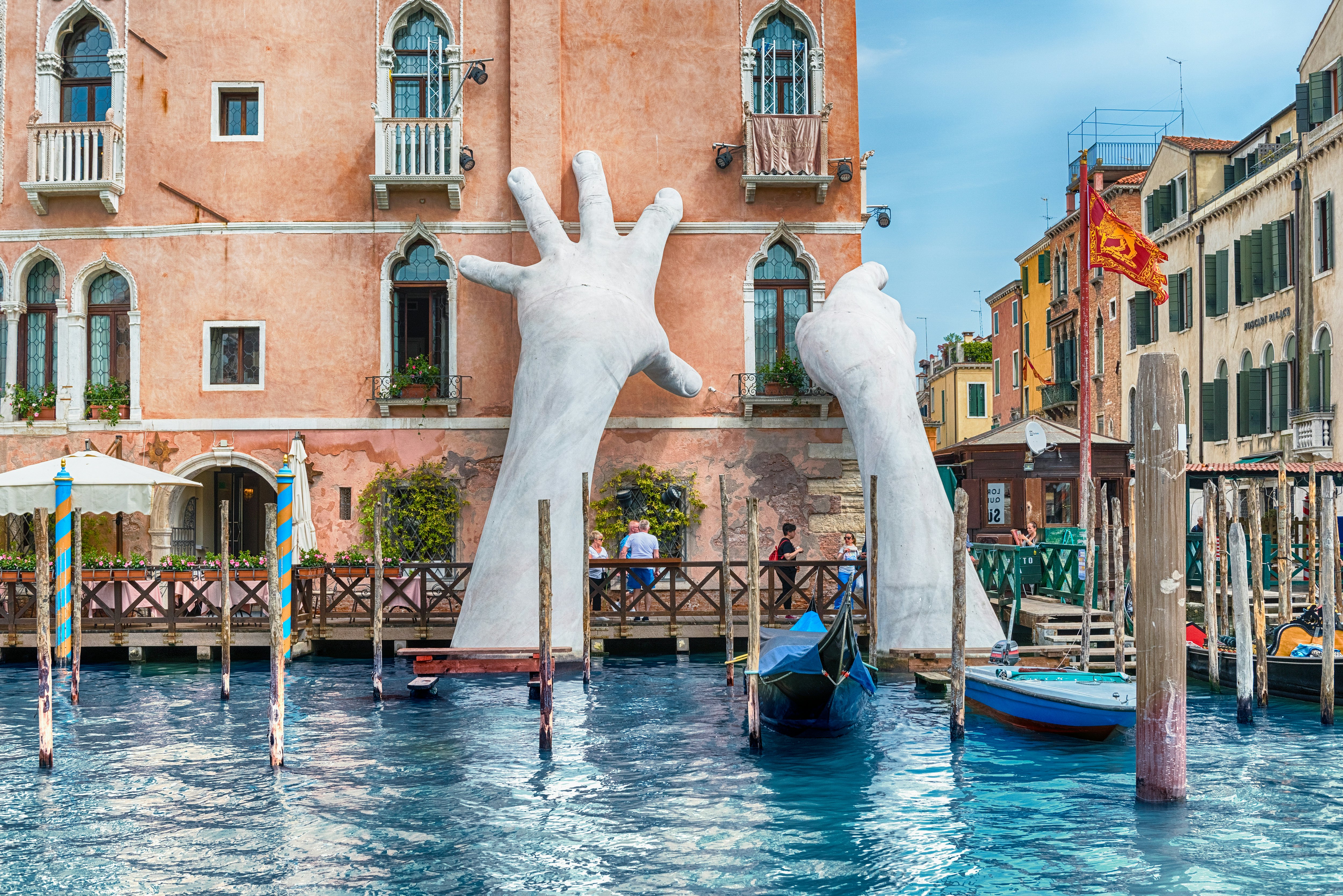 The scenic monumental sculpture of a child's hands called 'Support' by Lorenzo Quinn, installed in the Grand Canal of Venice, Italy, as seen on April 29, 2018.