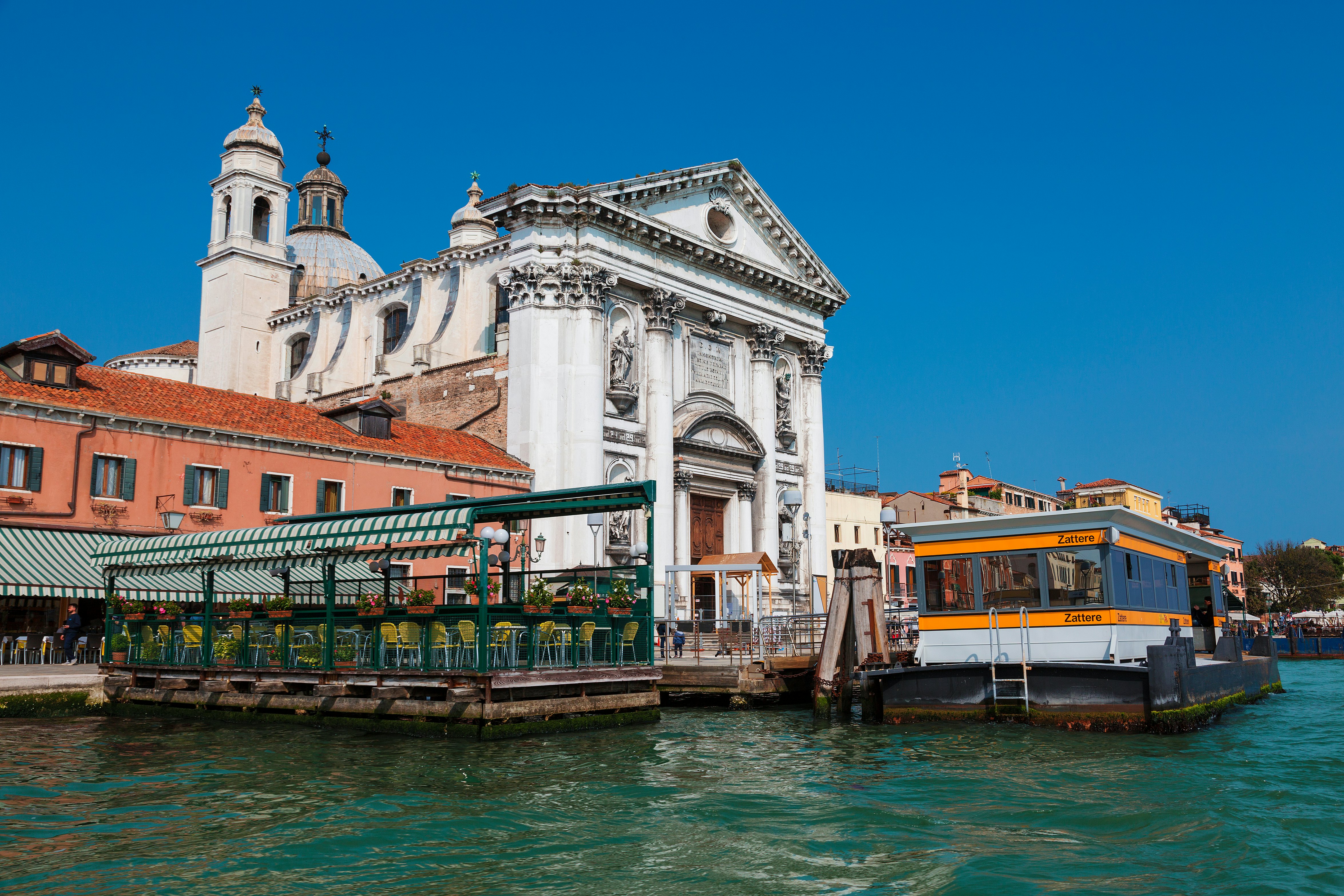A floating platform in a canal marking the stop for the local ferry public transport network.