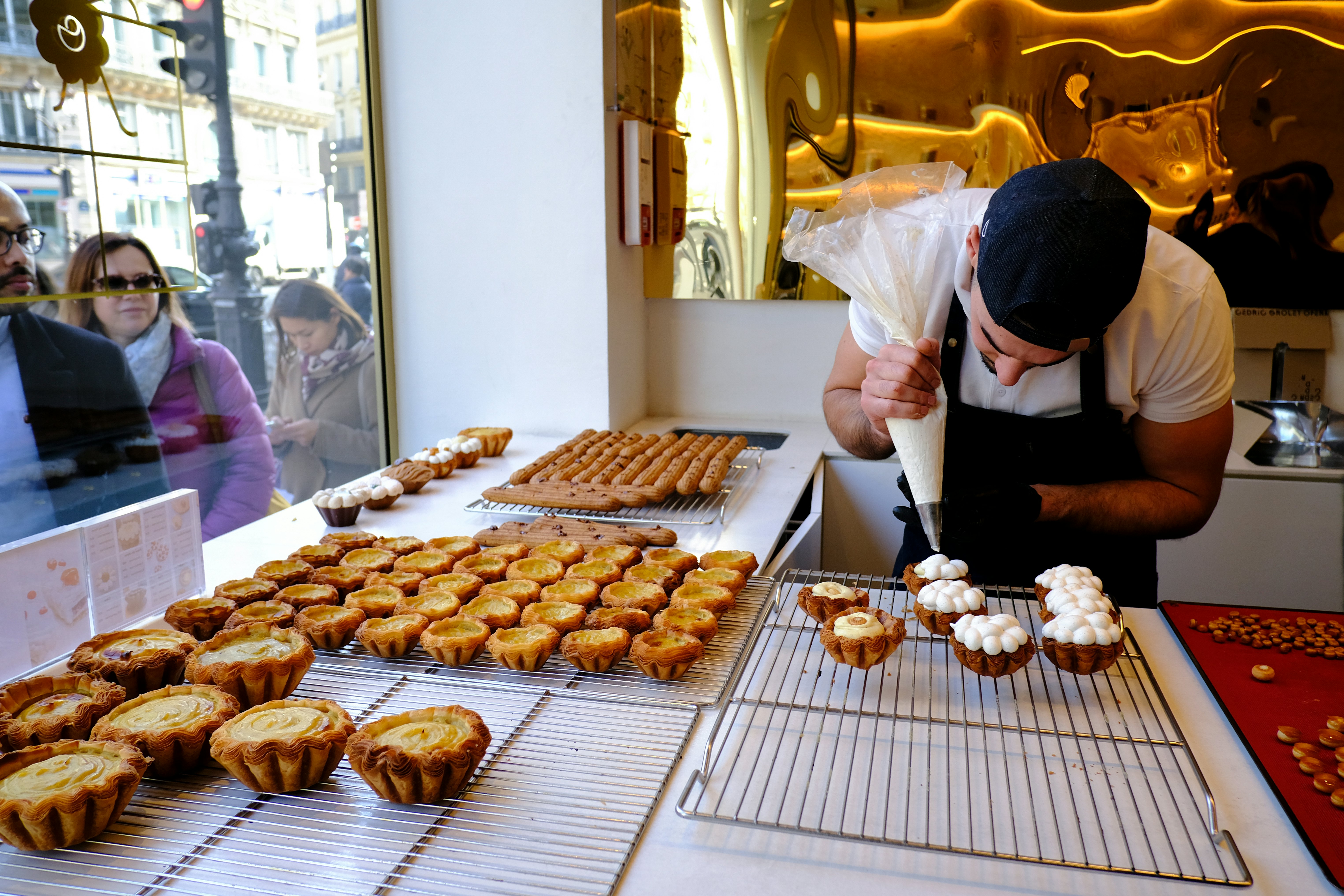 A pastry chef prepares traditional French desserts in Cedric Grolet's pastry shop in Paris, France.