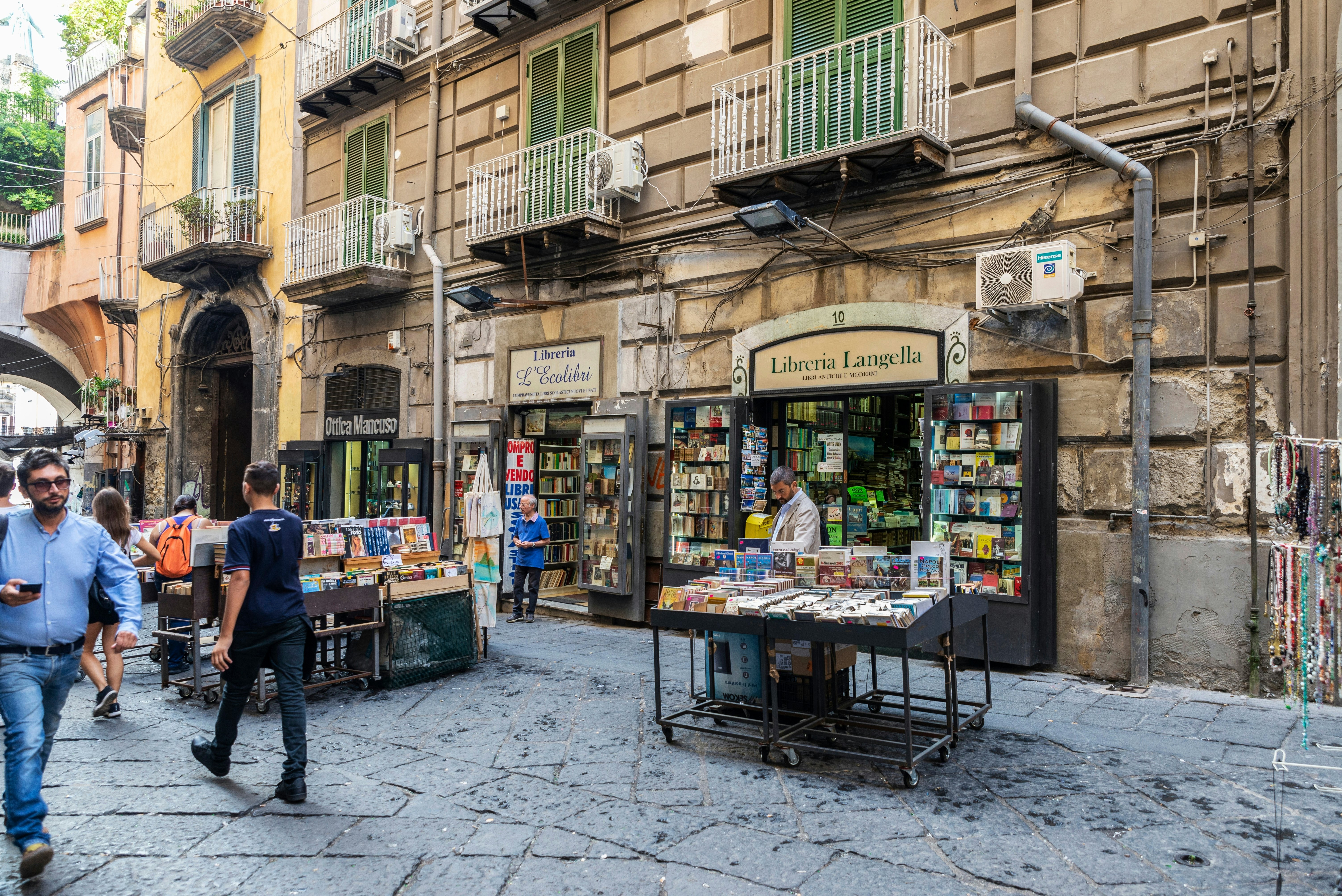Naples, Italy - Bookshops in the Port Alba with people around in Piazza Dante, one of the city gates in the historical center of Naples, Italy