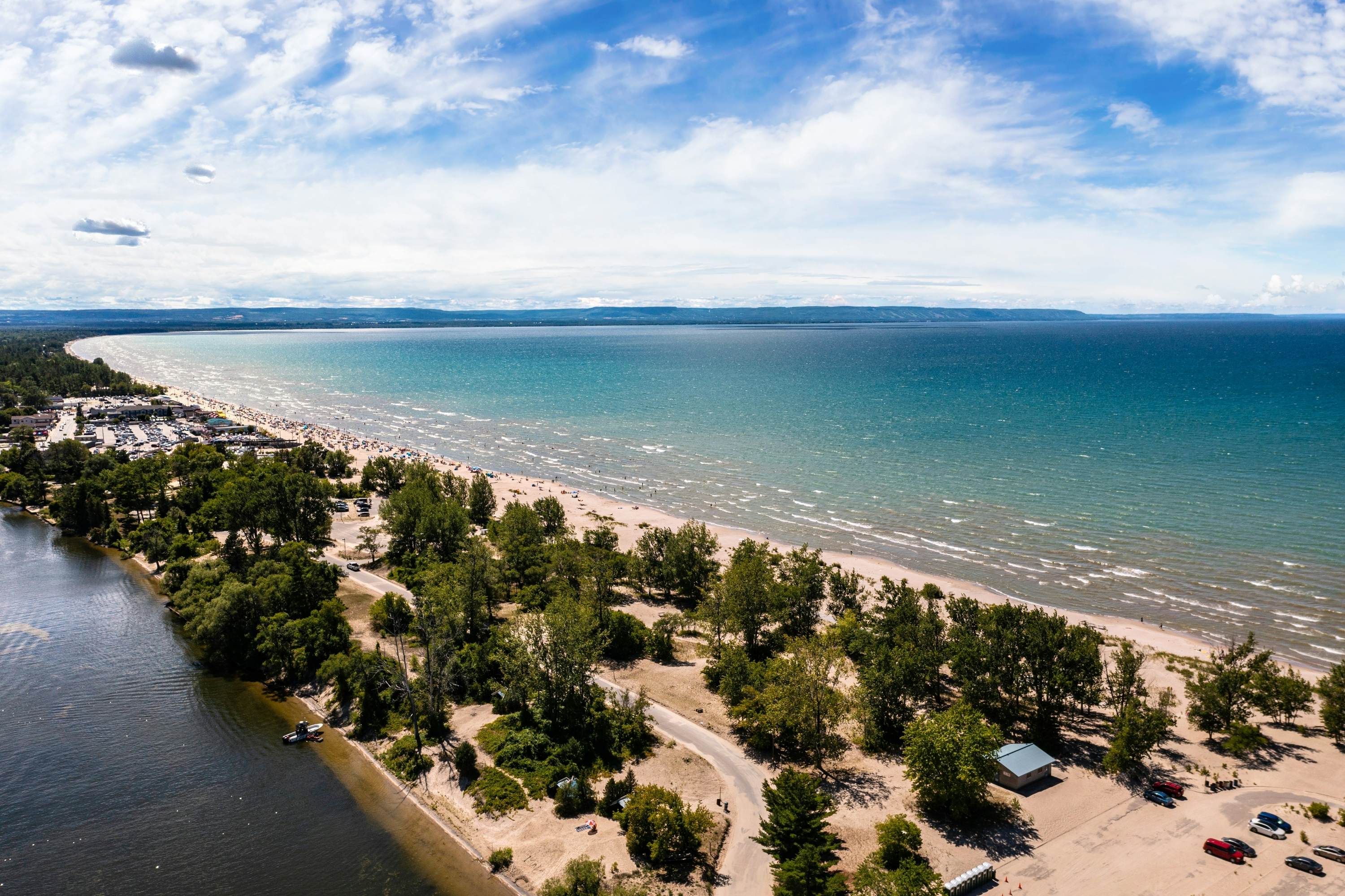 "Soar above Wasaga Beach with this mesmerizing drone photo. The image captures the beach under a beautiful blue sky dotted with fluffy clouds, exuding an air of tranquility and freedom."; Shutterstock ID 2303845603; purchase_order:65050 - Digital Destinations and Articles; job:Lonely Planet Online Editorial; client:Best beaches in Canada; other:Brian Healy
2303845603