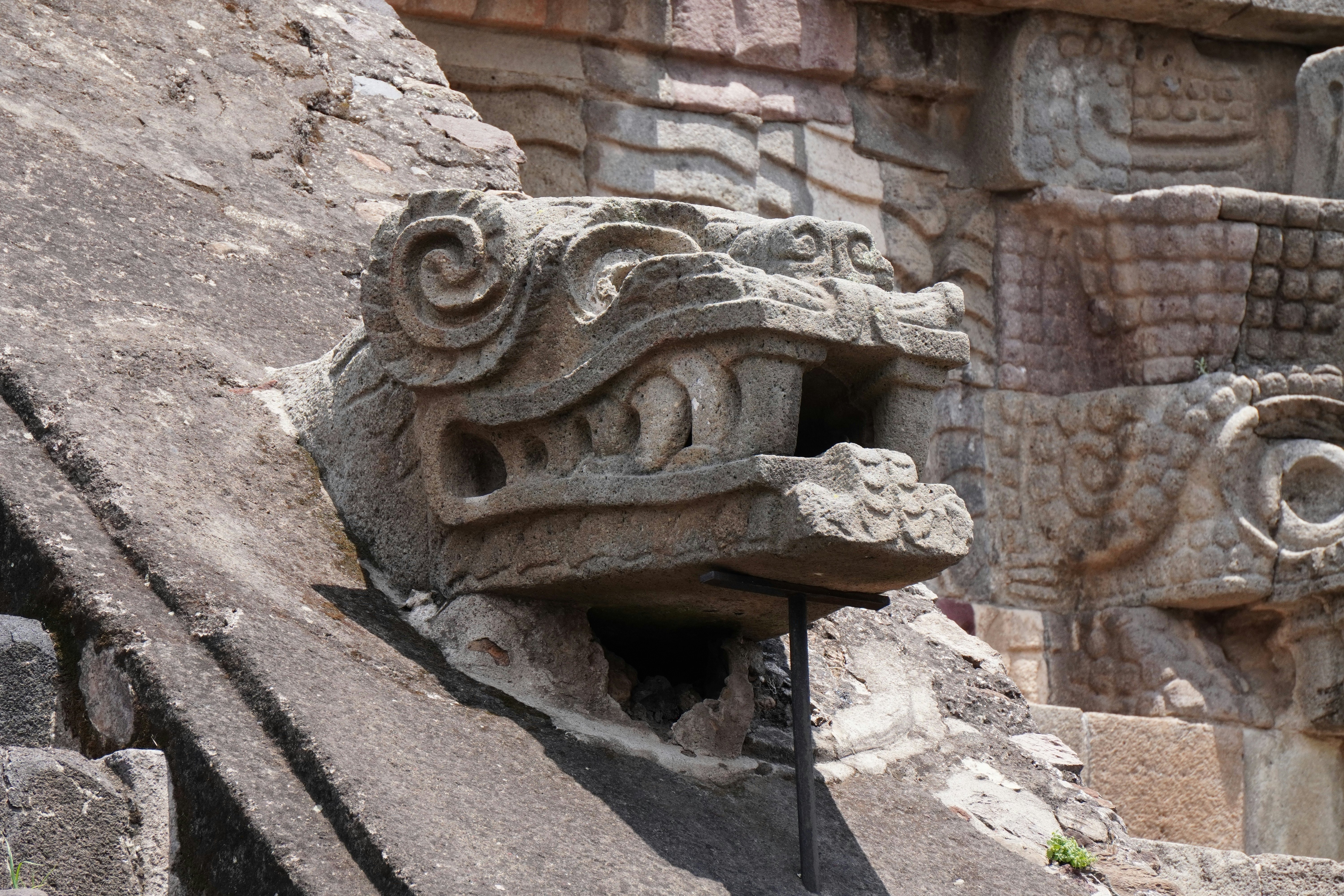 A sculpture of a serpent head at the Templo de Quetzalcóatl in the Teotihuacán archaeological complex, Mexico.